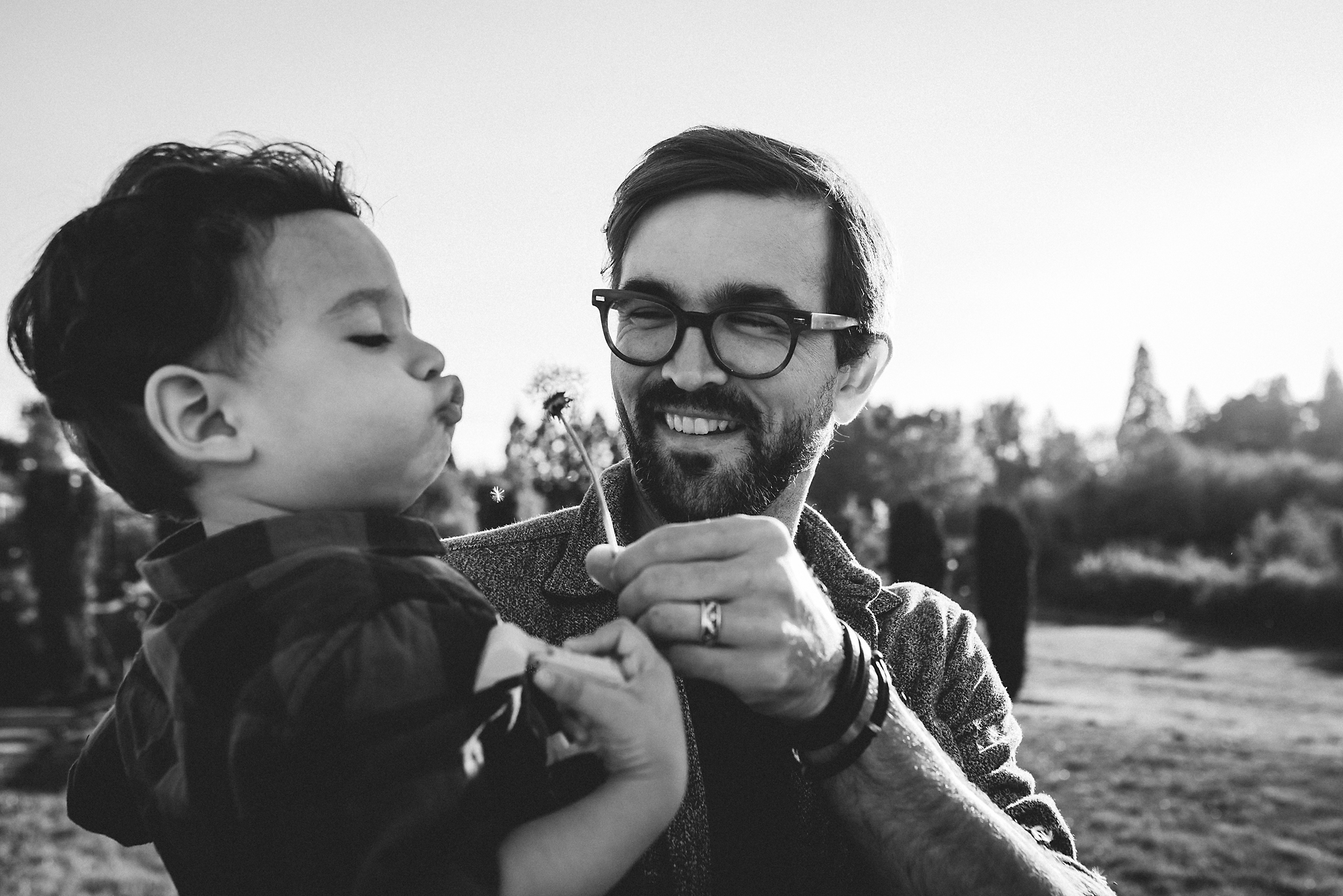 Dad and son with dandelion at Luscher Farms