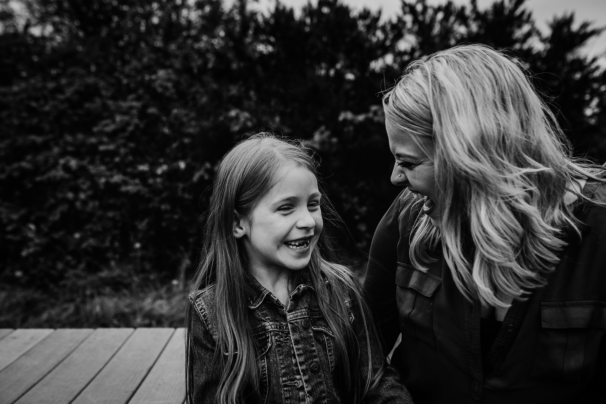 Mom and daughter laughing in Lake Oswego