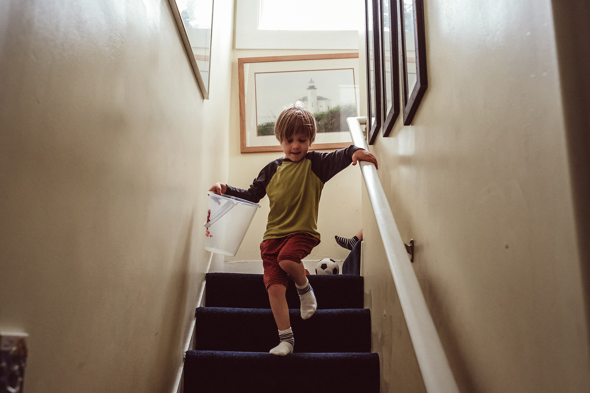 Boy walks down stairs