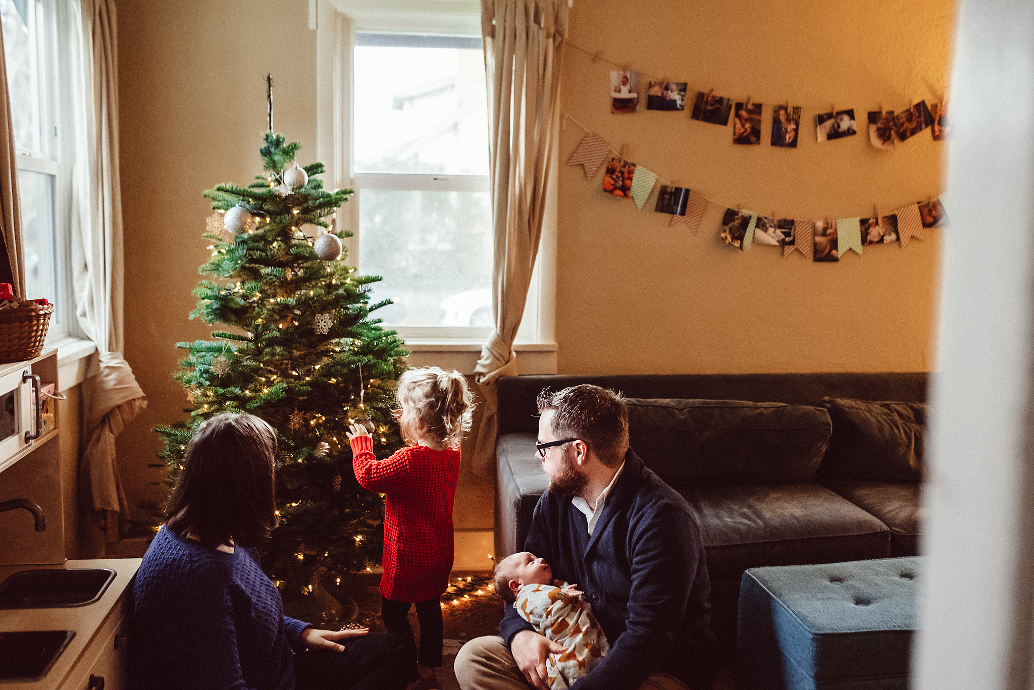 Family decorates Christmas Tree in Portland