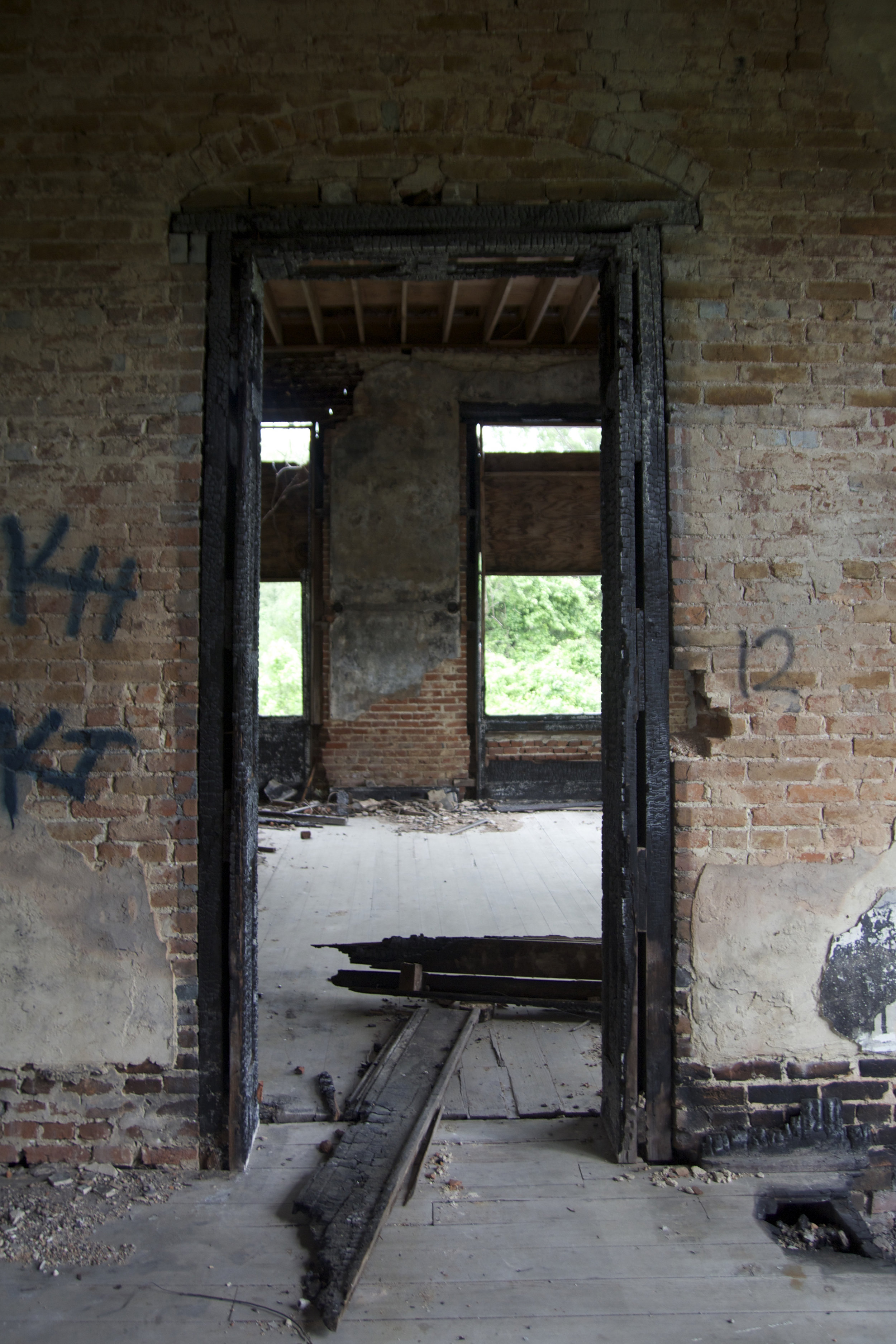 More visible fire damage to the 2nd floor bedrooms as a result of the 2002 fire. The damage to this particular room makes me think that the attic fire likely started above this room.