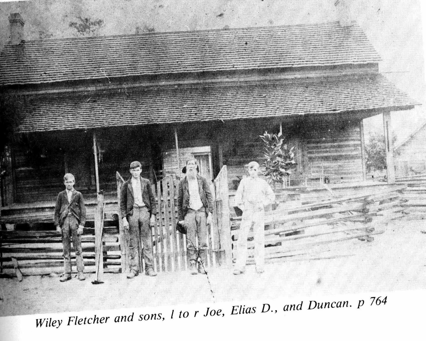 Wiley Fletcher with his sons in front of this home before the dogtrot had been enclosed.