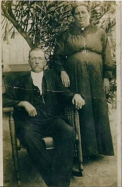 E.G.M. Fletcher and his first wife, Polly in front of this home