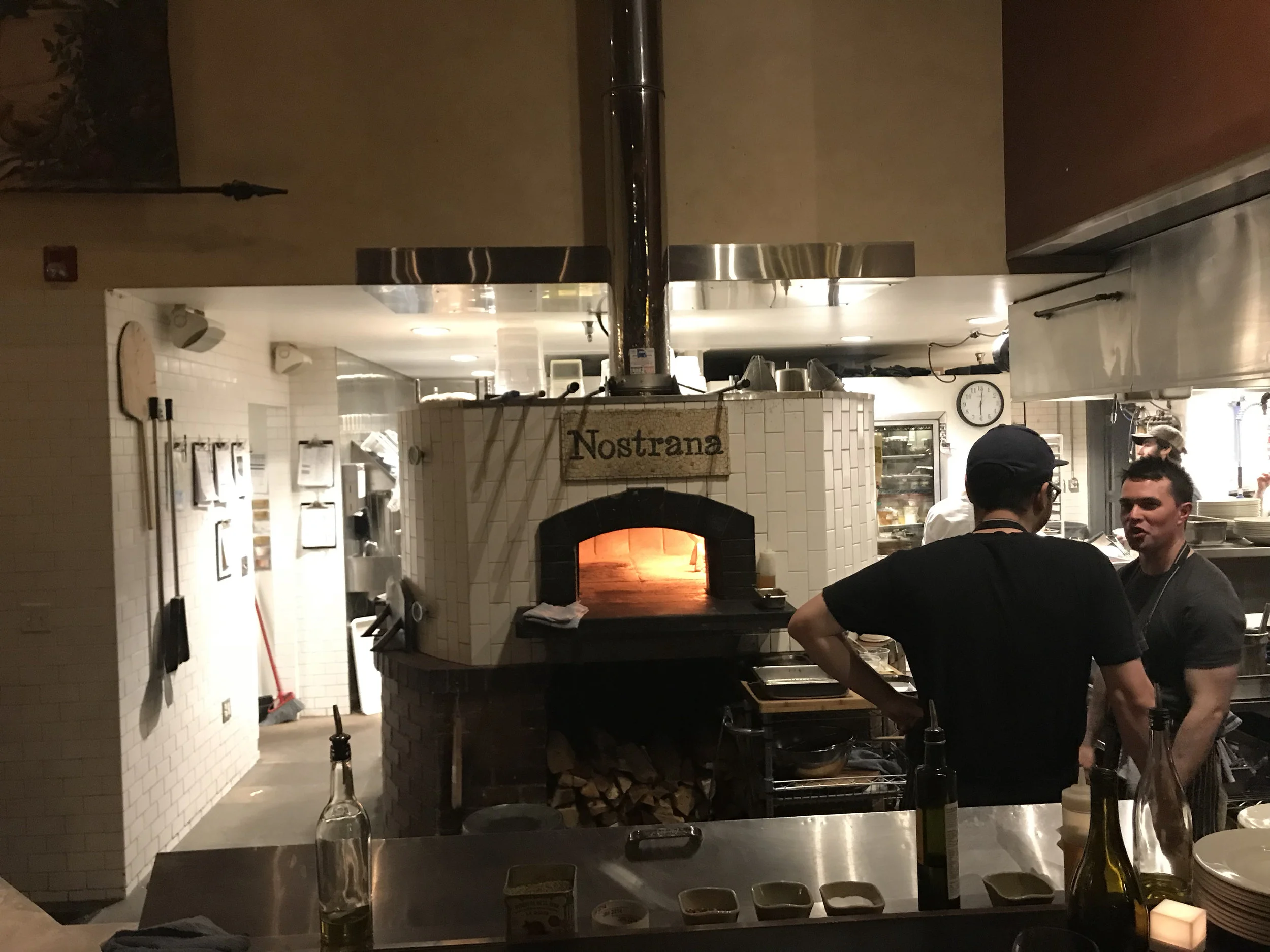 The open kitchen and wood-fired oven at Nostrana adds to the ambiance considerably. Plus, with things all in view, the smells eminating from within just go to work on your senses. Hmmm...I think I'm hungry right now! Image Courtesy: Dan Meyers