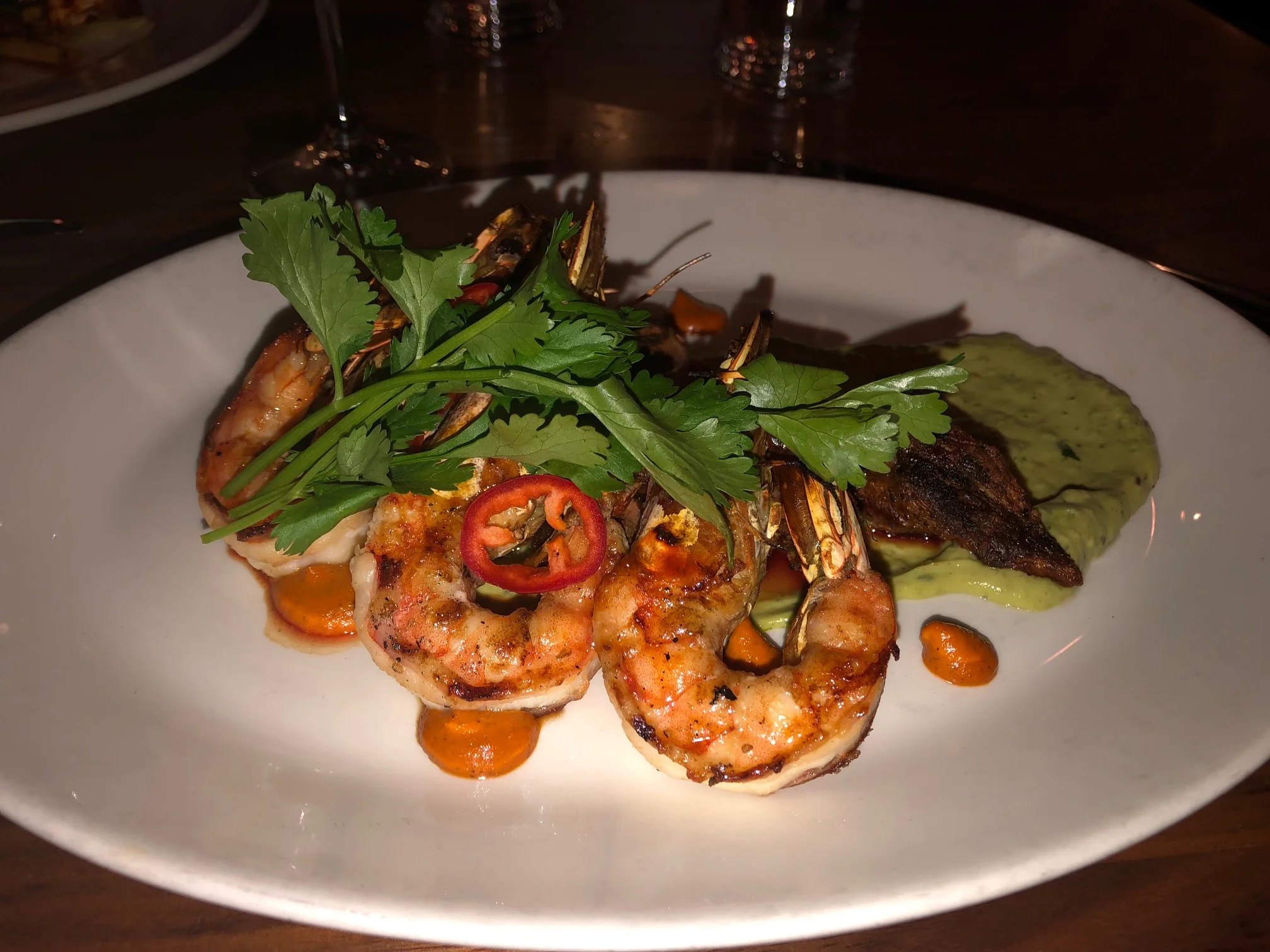  Here is my entree, the Brandt Beef Flat Iron Surf & Turf with Kauai prawns, avocado puree, piquillo salsa (GF). Needless to say, I was quite happy with this selection. The steak was very nice and the prawns, well, I could have eaten 10 more! Image Credit: Dan Meyers 