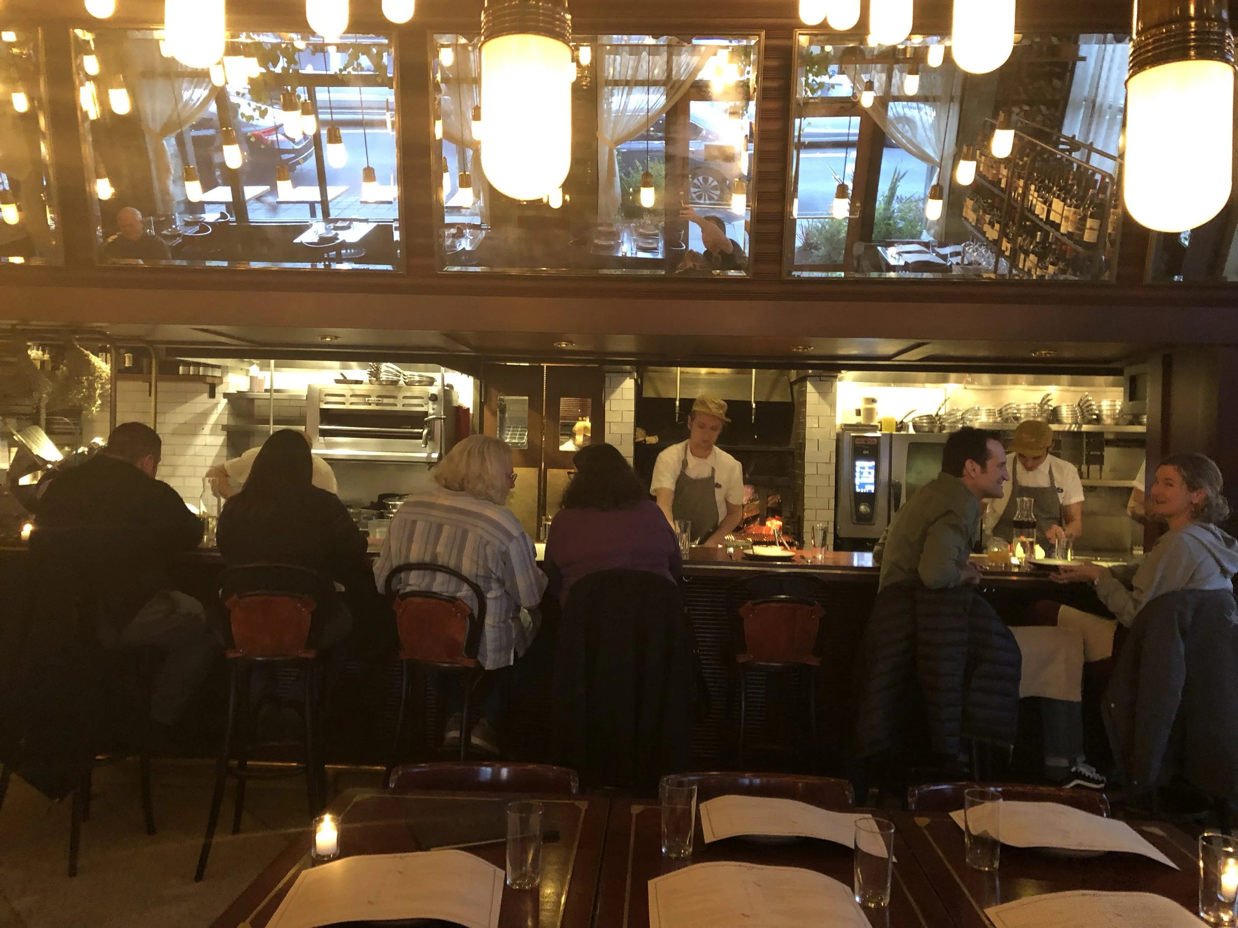 A look at the open kitchen inside Ava Gene’s. The wood burning fire and the smell of 5-star cooking fills the place. Image Courtesy: Dan Meyers