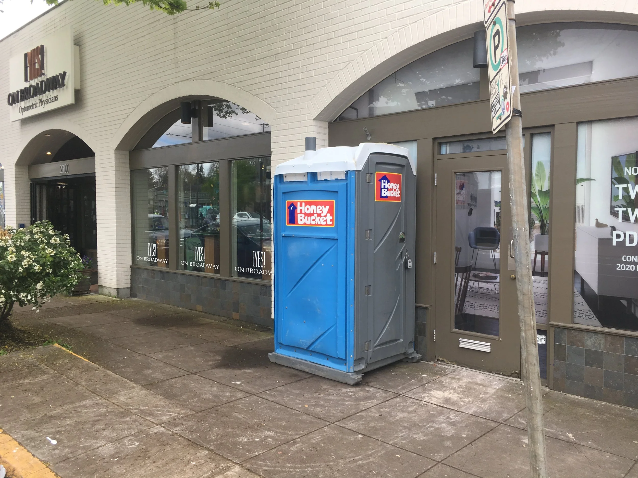Success drives the need for more space…and Eyes on Broadway has been voted the top eyewear shop in Portland for 4 years running . Of corse the Honey Bucket is only temporary! ;) Image Courtesy: EyesOnBroadway