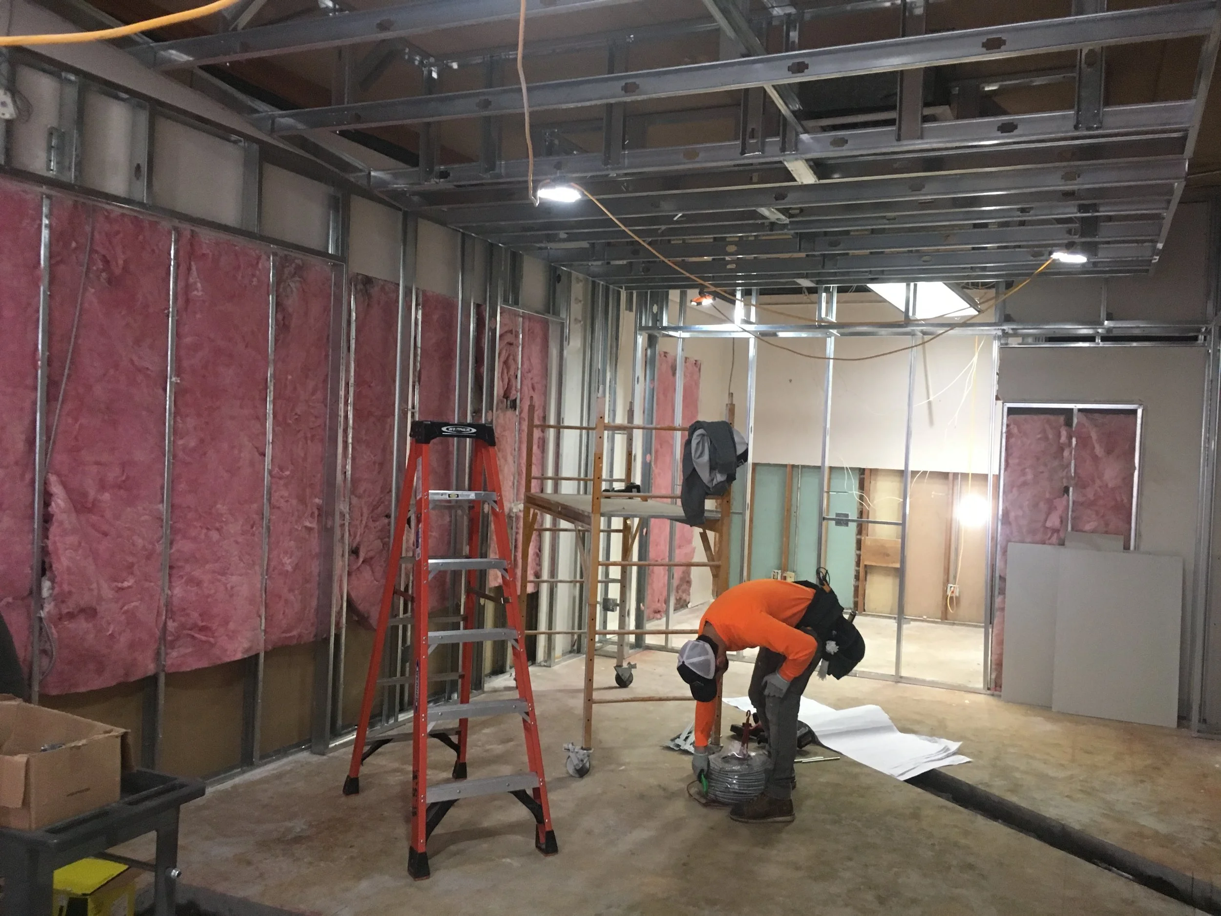 This view, looking into the space from what will be the expanded, front window area, shows the larger showroom and additional exam room entry. Image Courtesy: Eyes on Broadway
