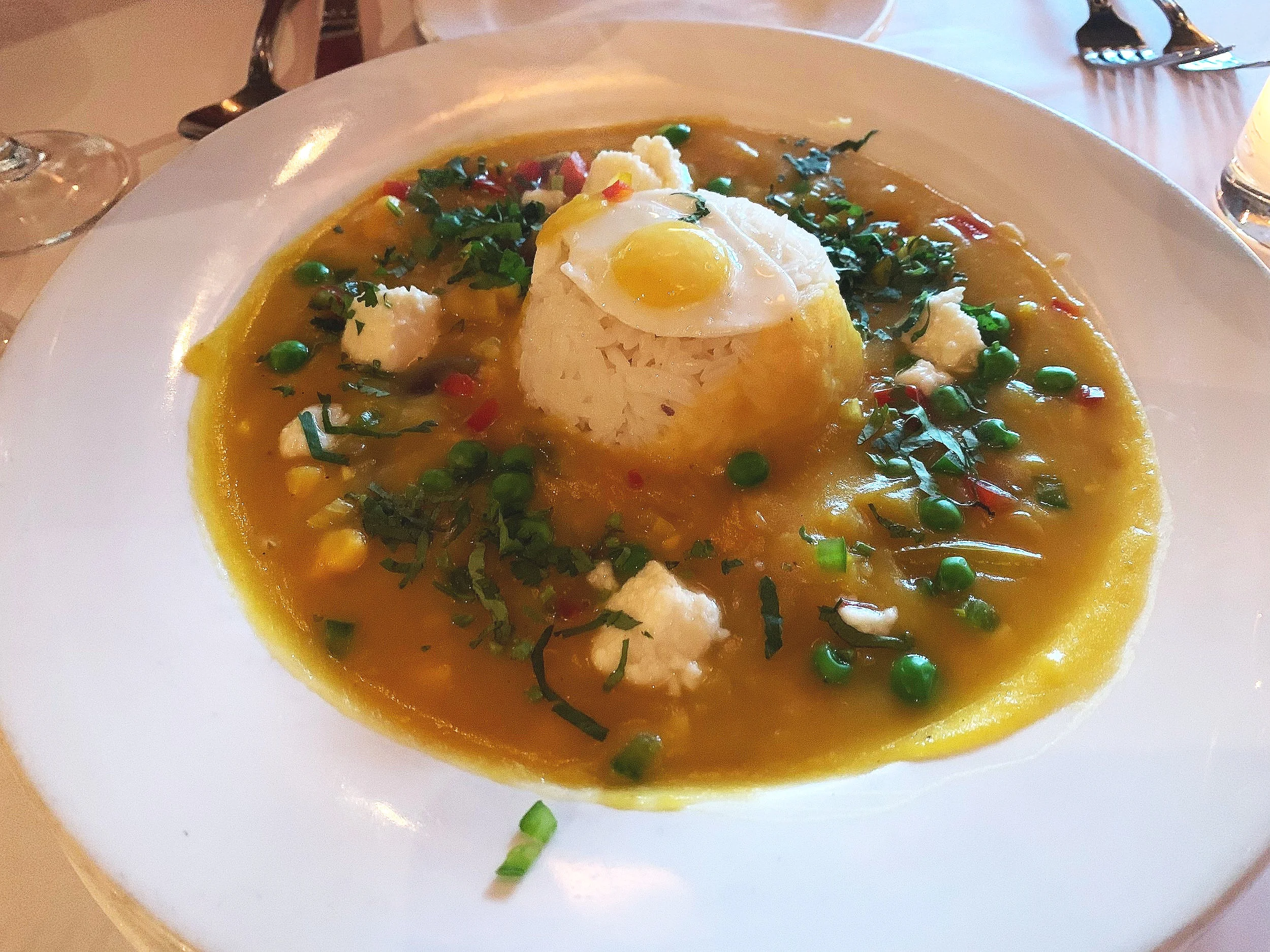  This squash soup, which we had as our first tapas serving, was so darn good I don’t even know where to begin. Really, this soup is worth the visit alone. Here is the menu listing: LOCRO SERRANO squash stew with Andean tubers and cheese, served with garlic rice and a fried quail egg 12.5 - Image Courtesy: Dan Meyers 