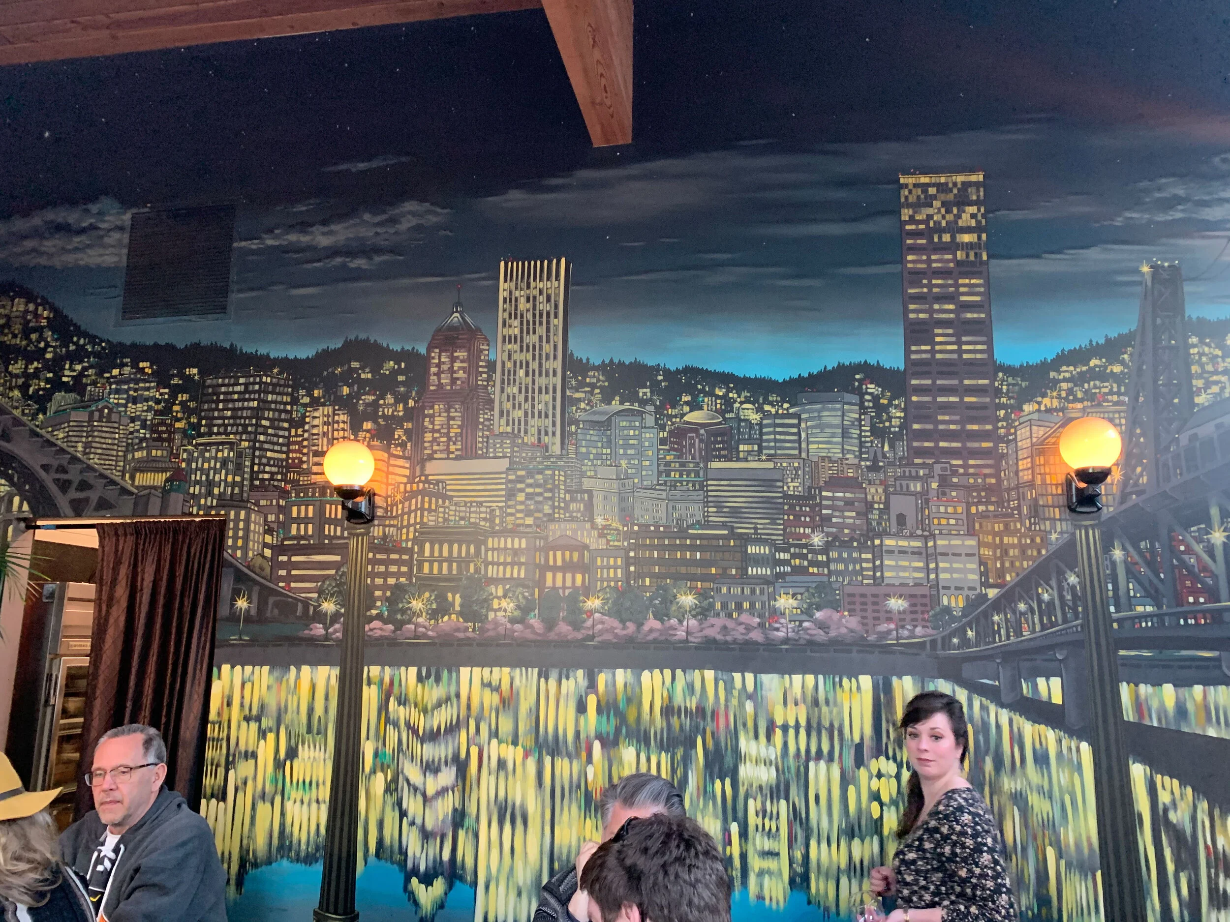  This great mural of Portland graces the western wall at The Box Social. Just love how the streetlights are built into the painting. Image Courtesy: Dan Meyers 