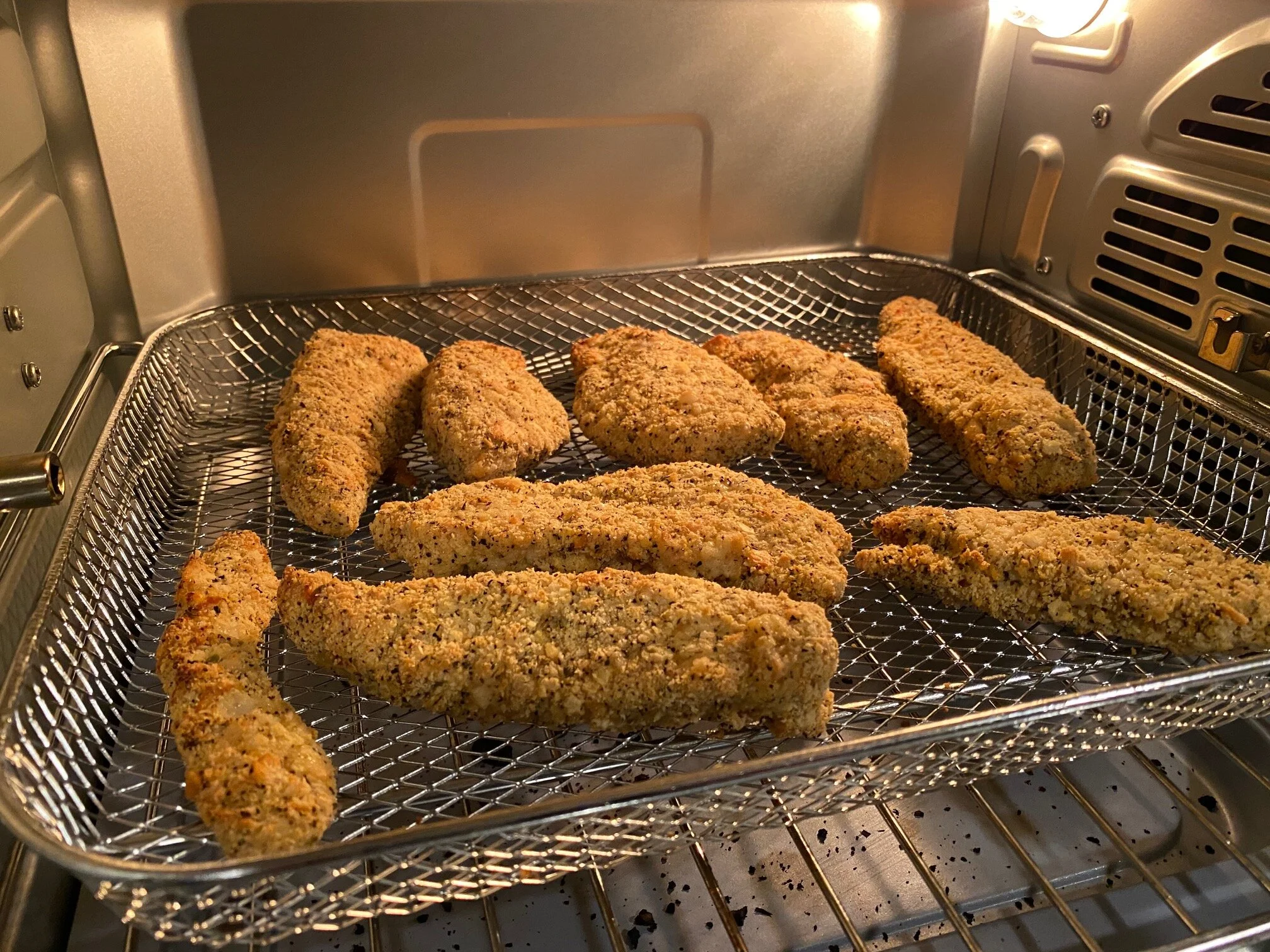 Here’s a shot of my last batch of air fried chicken. Honestly, there’s no way to tell it’s not “regular fried chicken” other than it doesn’t leave you with a greasy, heavy feeling. So, I guess there is a way! It’s much better… Image Courtesy: Dan Meyers