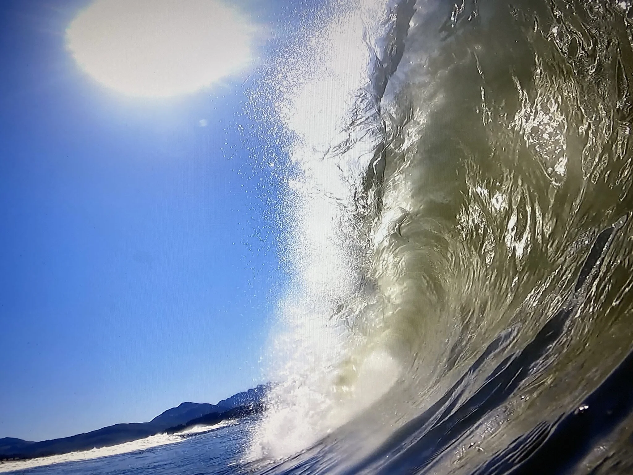 A screen grab of a close-out barrel cranking towards the sand north of Cannon Beach, Or. Image Courtesy: Mark Perrin