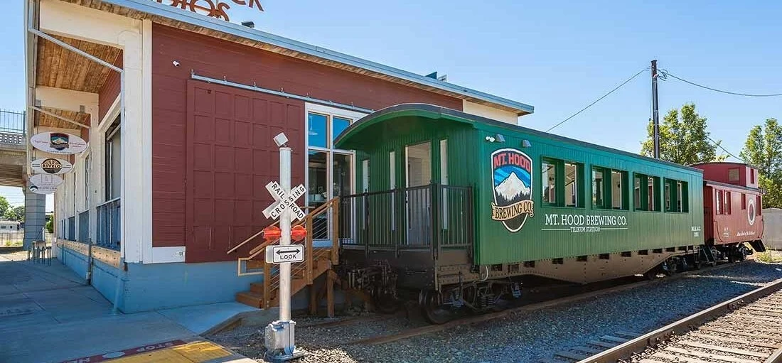 Outside Mt. Hood Brewing’s Tillikum Station. The two train cars are part of your choices for sitting/eating. Image Courtesy: Timberline Lodge