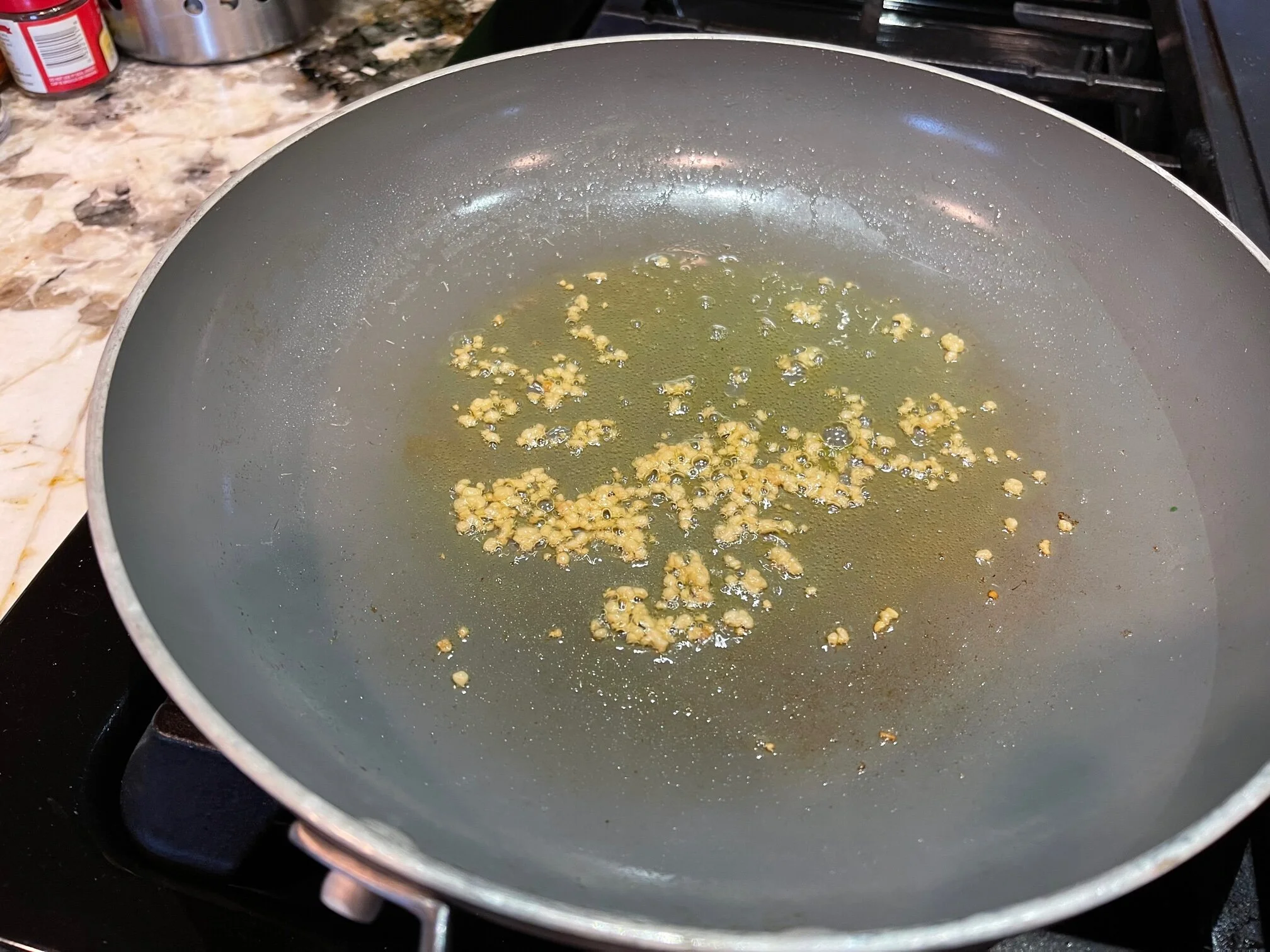 Lightly brown the garlic in olive oil. Image Courtesy: Dan Meyers