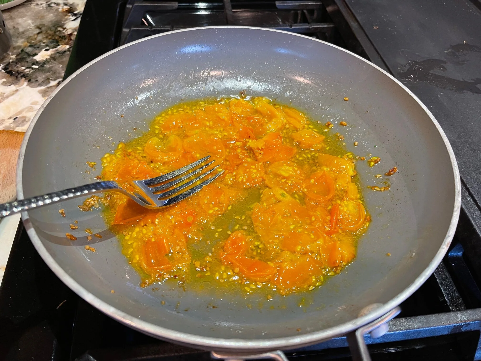 Smash the cherry tomatoes to release their juices. Image Courtesy: Dan Meyers