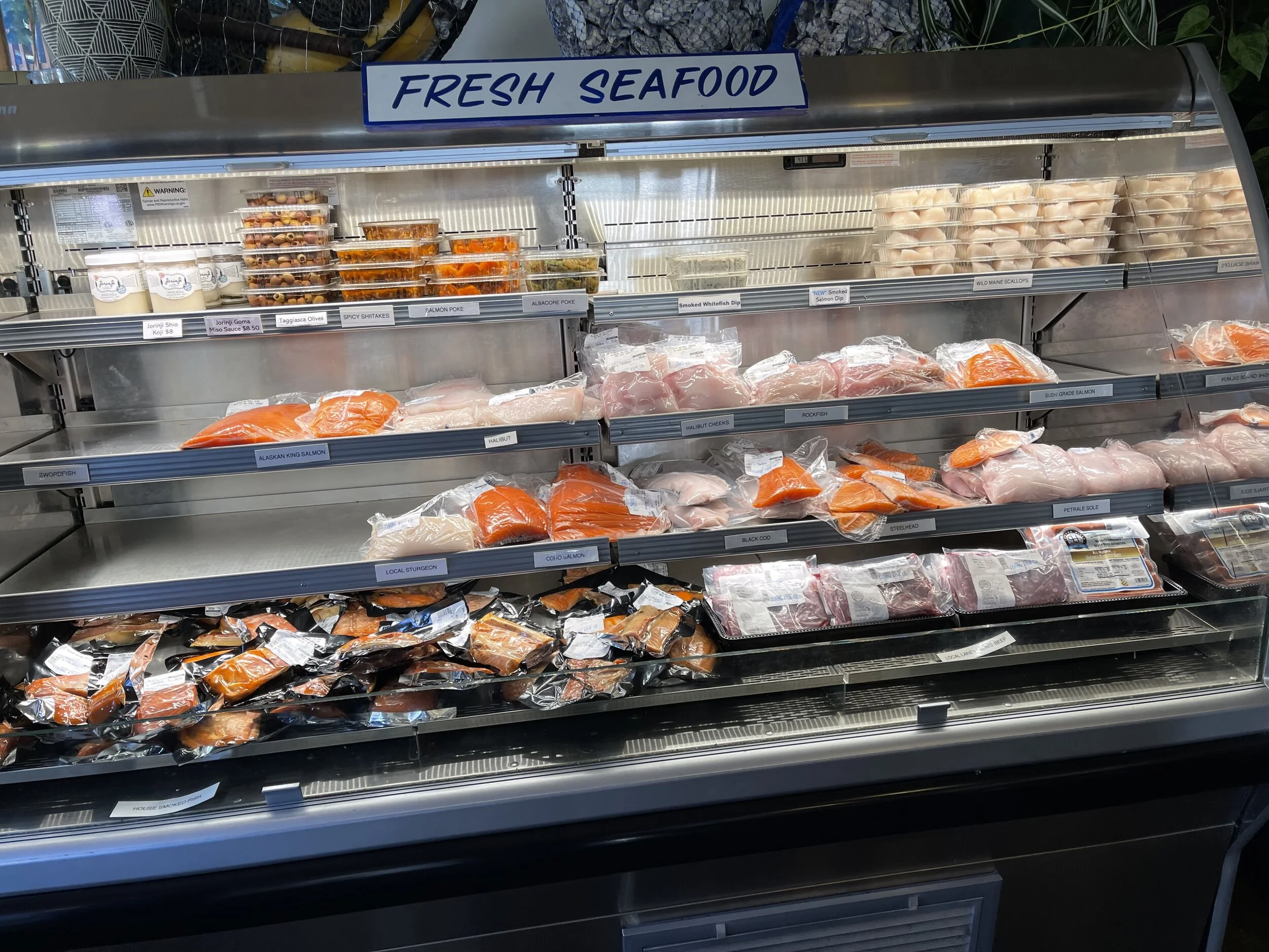 One of the several fresh seafood display cases at the Flying Fish Co. So darn good. Image Courtesy: Dan Meyers