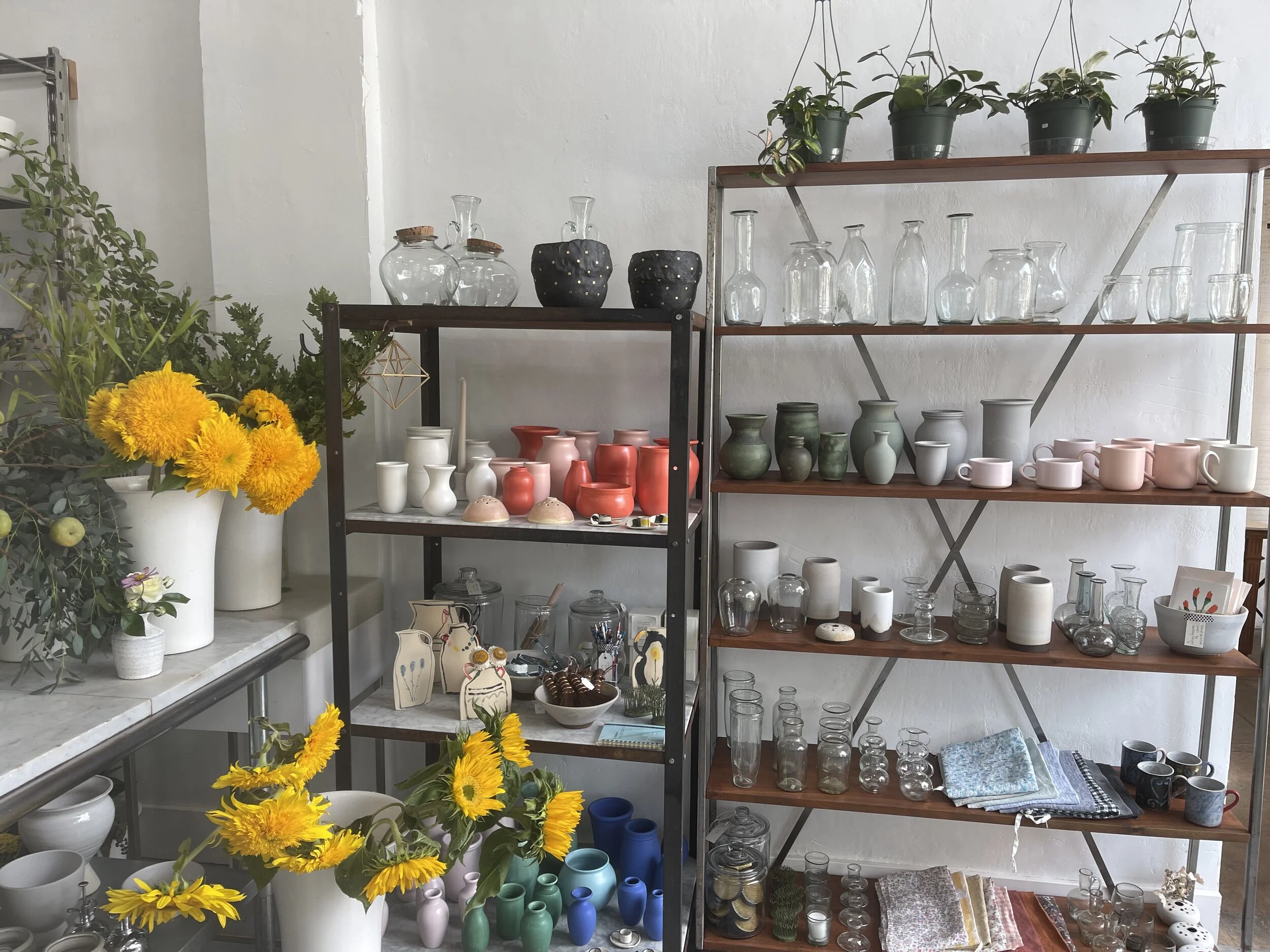  Along with flowers for sale, a nice assortment of vases and locally-crafted pottery can be found at Hilary Horvath’s quaint, pretty shop.  Image: Dan Meyers 