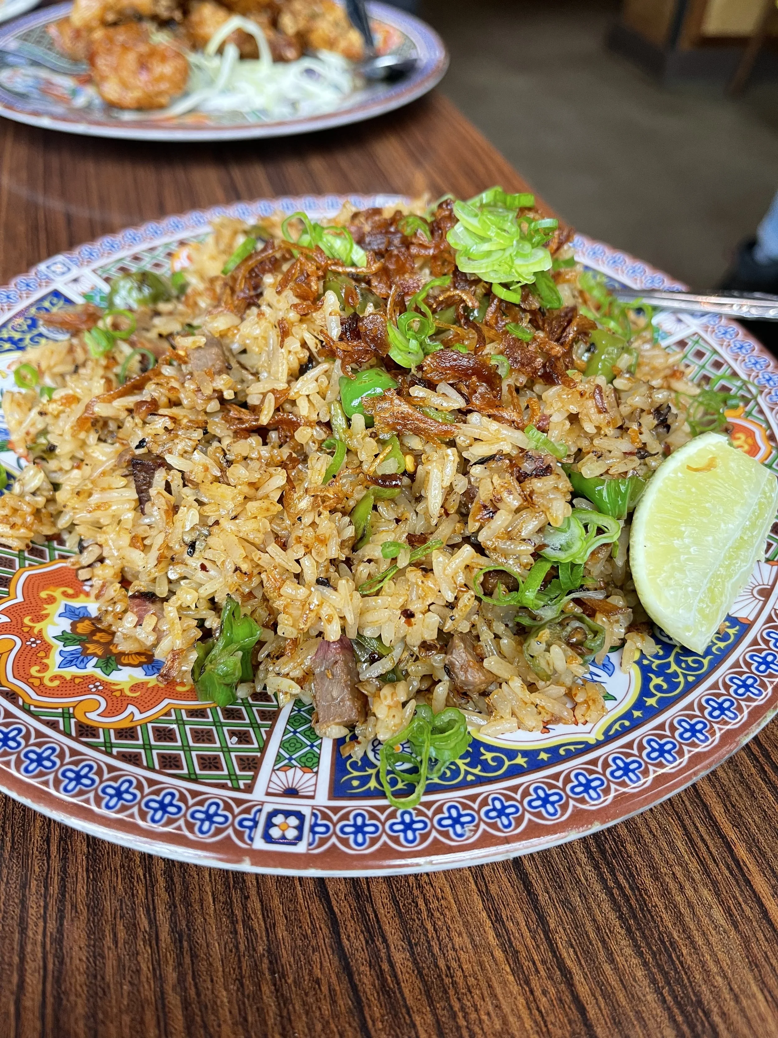 The BBQ Fried Rice with Brisket featuring shishoto peppers, chili jam, and fried shallots. A very nice accompaniment. Image Courtesy: Lee Holcomb