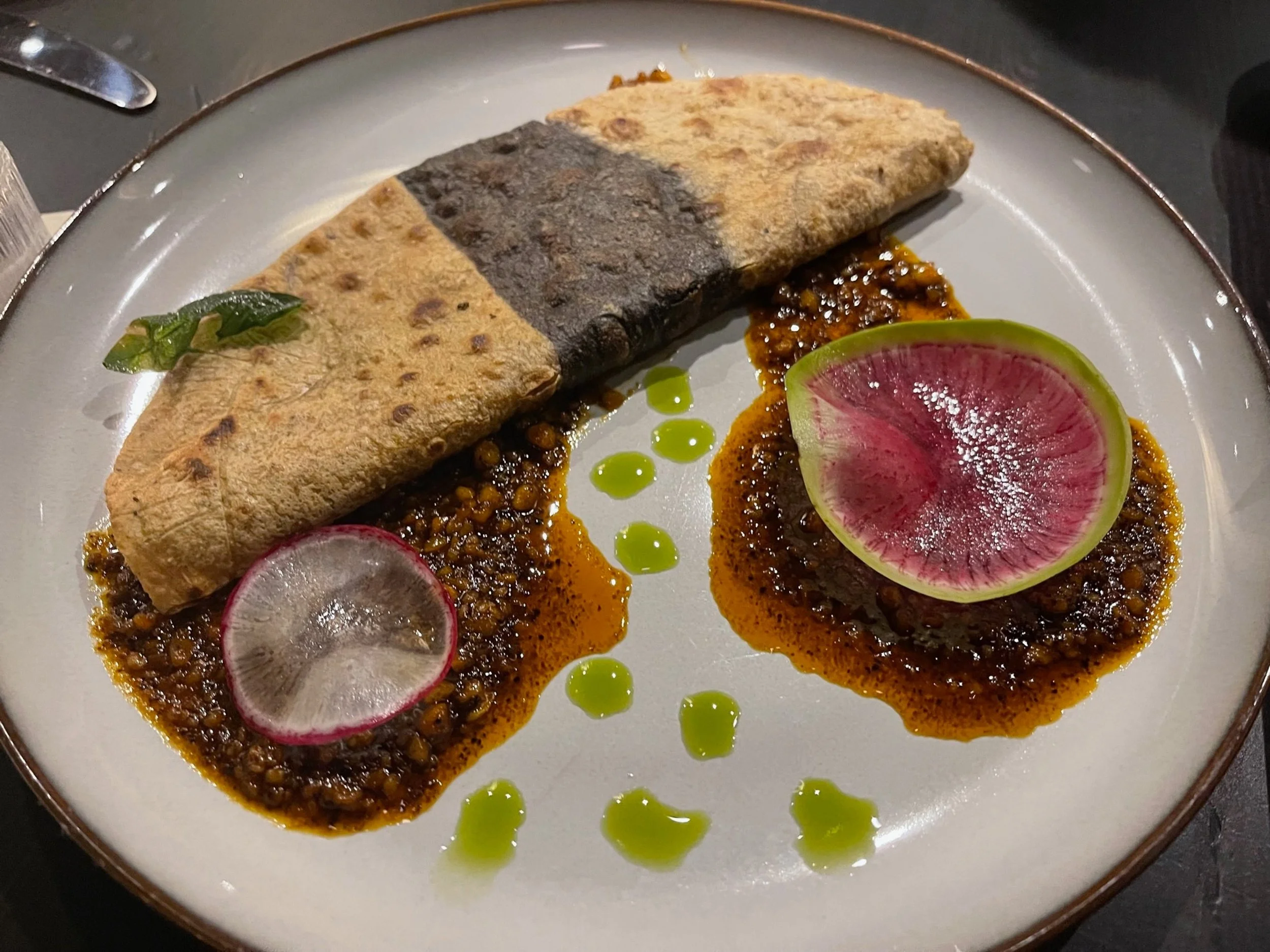 This is not your average quesadilla. In fact, the Quesadilla Oaxaquena, s actually comprised of three types of maiz: white, blue, and yellow, and features quesillo, chile morita, and peanuts. Image: Dan Meyers