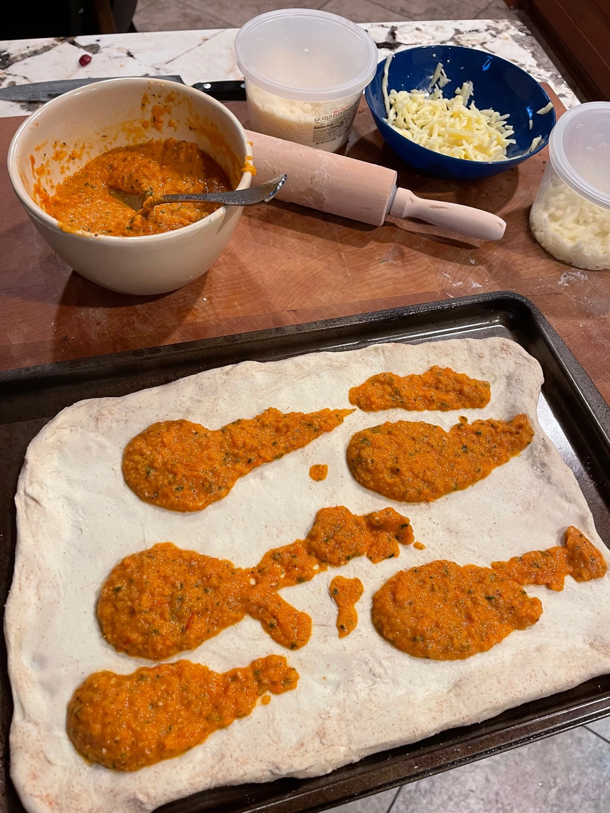 Spread the sauce as thick as you like. Get ready to add the cheese! Image Courtesy: Dan Meyers
