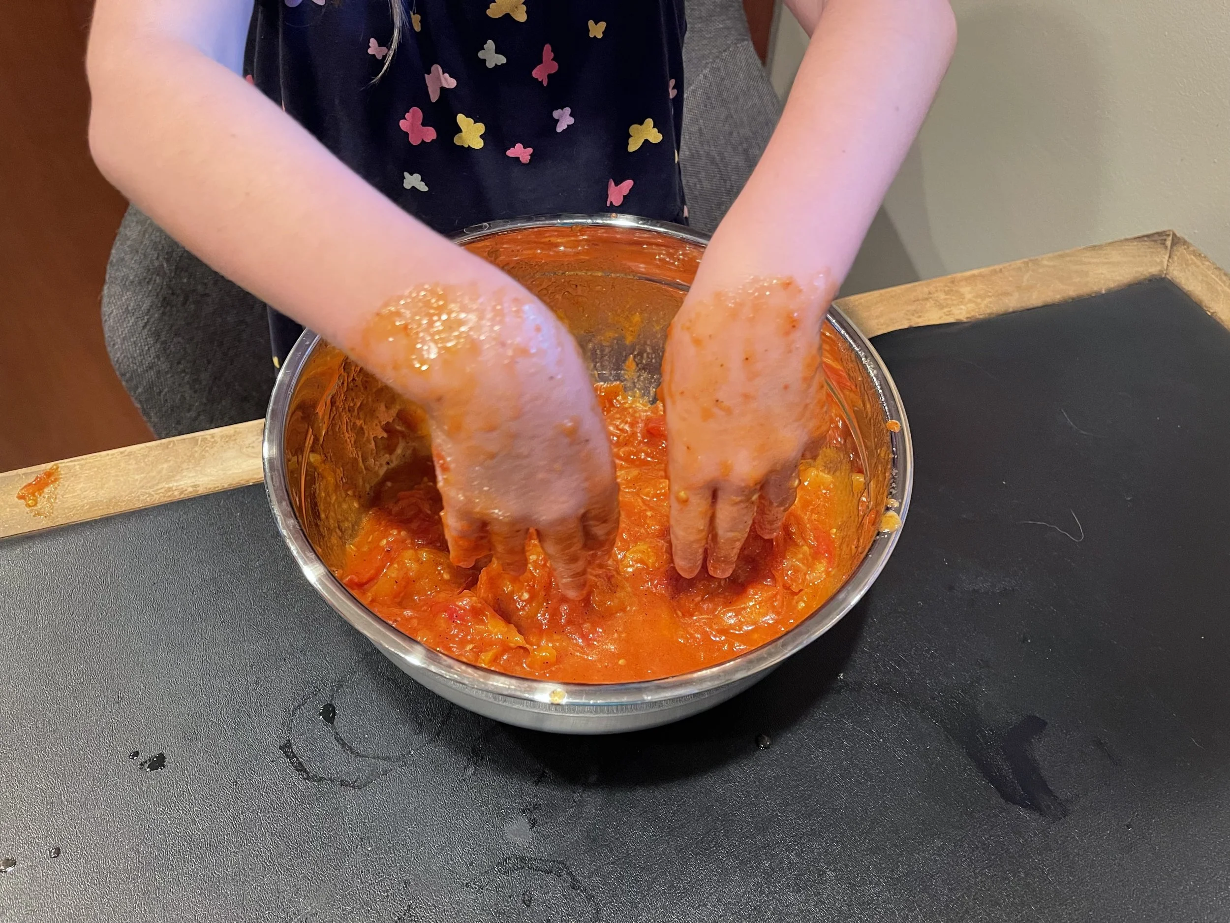 Hand smashing the roasted tomatoes is a lot of fun, especially for kids. Image Courtesy: Dan Meyers