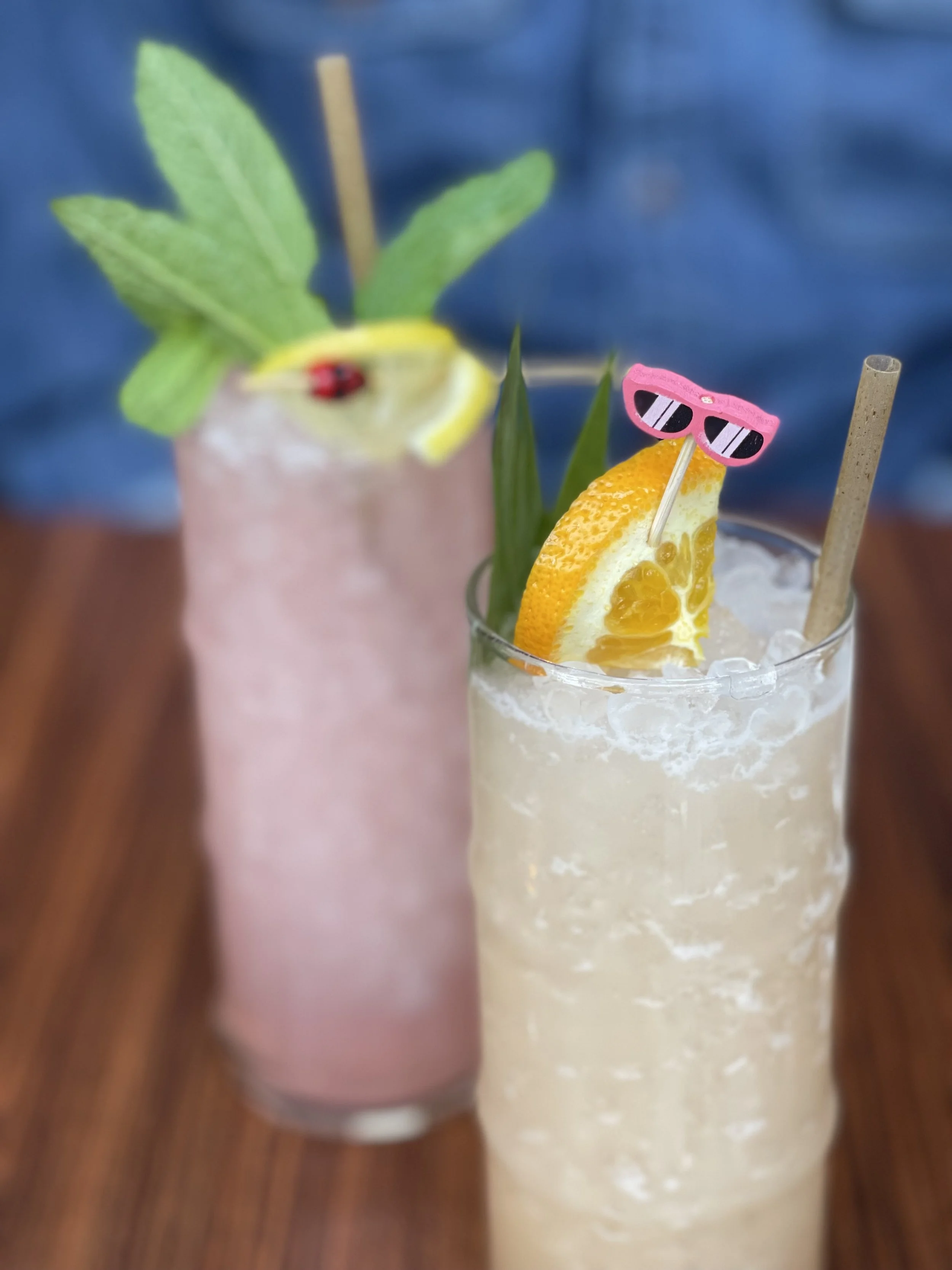 Two of eems amazing cocktails. Picture here are two non-alcholic options, the Salad Days (front) featuring sour apple, tamarind, coconut, and palm sugar; as well as the Strawberry Almond Cooler featuring berries, lemon lime, almond, and sneaky spice. Very refreshing. Image Courtesy: Lee Holcomb