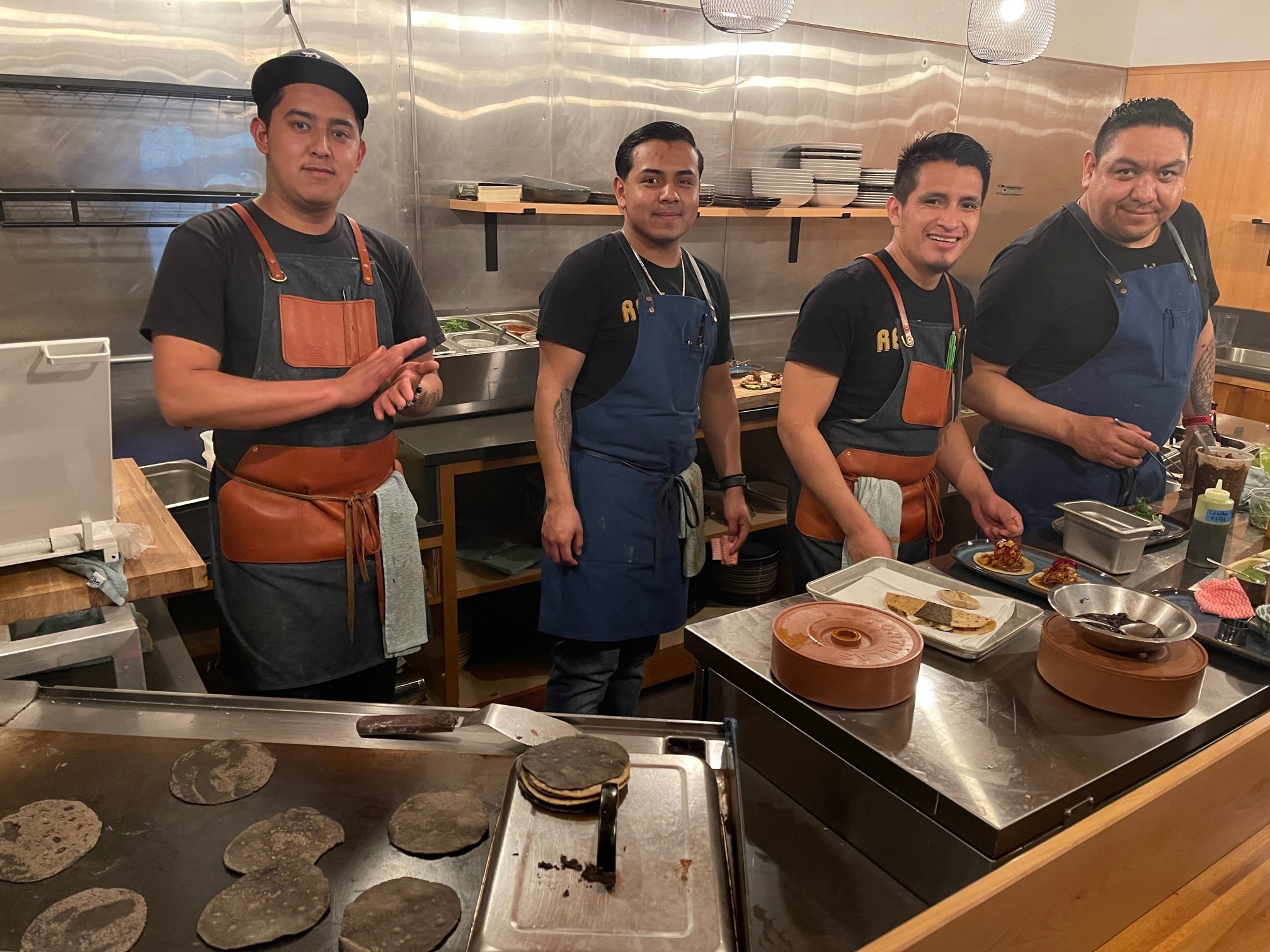 After dining at De Noche I asked to take a picture of the chefs in their open kitchen. You can see the warmth and pride in their smiles. What a great place! Image Courtesy: Dan Meyers