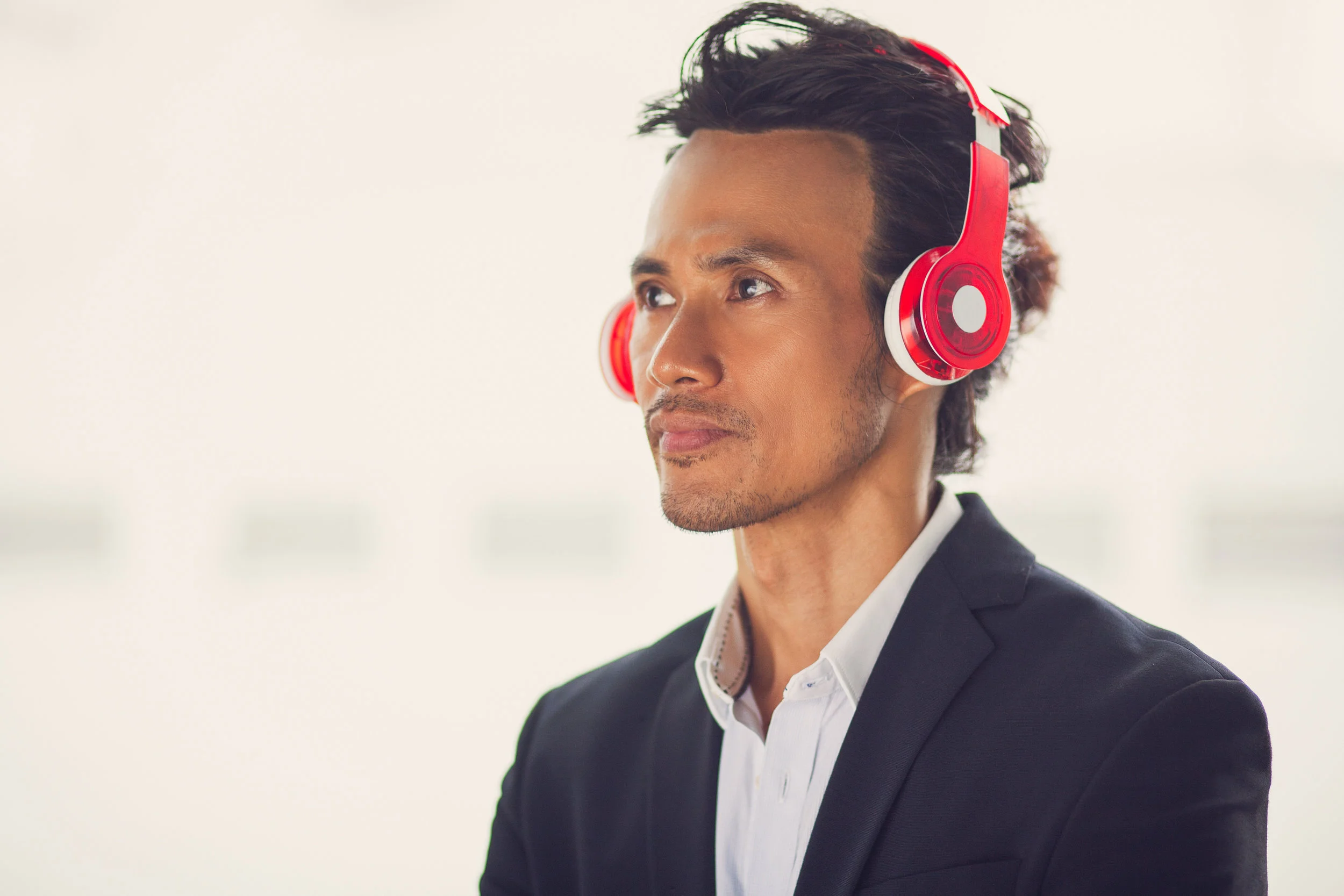 Man(Asian)_Listening_to_Headphones.jpeg