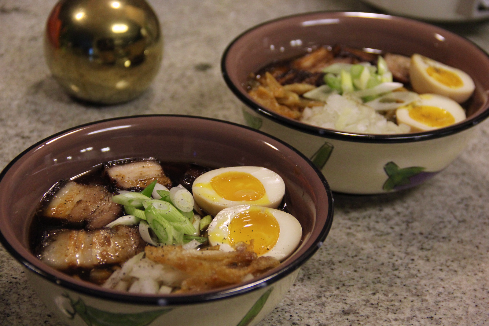 Our painstakingly made ramen! Toppings are marinated pork belly cooked for a million years, fried chicken skin + oil, ajitama, onions, green onions, and a dash of pepper! Was super delicious but would I do the whole process again? Unclear.