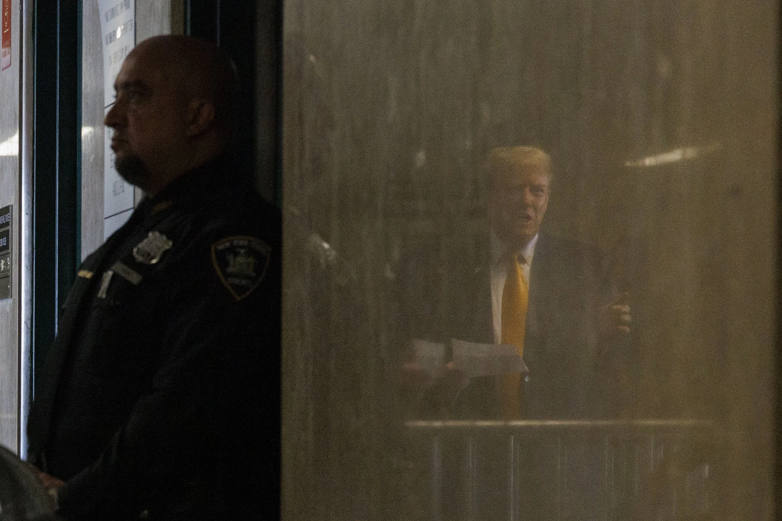  Former U.S. President and current Republican presidential candidate Donald Trump speaks to the press, as seen in a reflection, before he attends his trial at Manhattan Criminal Court in New York, New York, USA, 07 May 2024. Trump is facing 34 felony