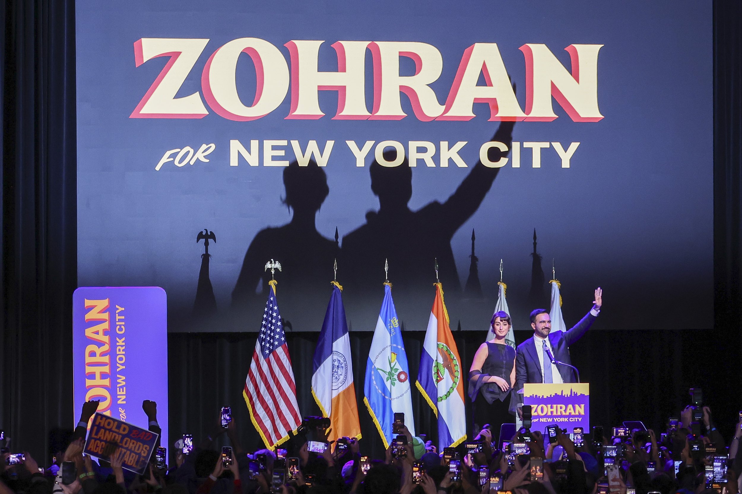  Mayor elect of New York City Zohran Mamdani (L) and his spouse Rama Duwaji (R) wave to the crowd during an election party hosted by Mamdani at the Brooklyn Paramount in the Brooklyn borough of New York, New York, USA, 04 November 2025. 
