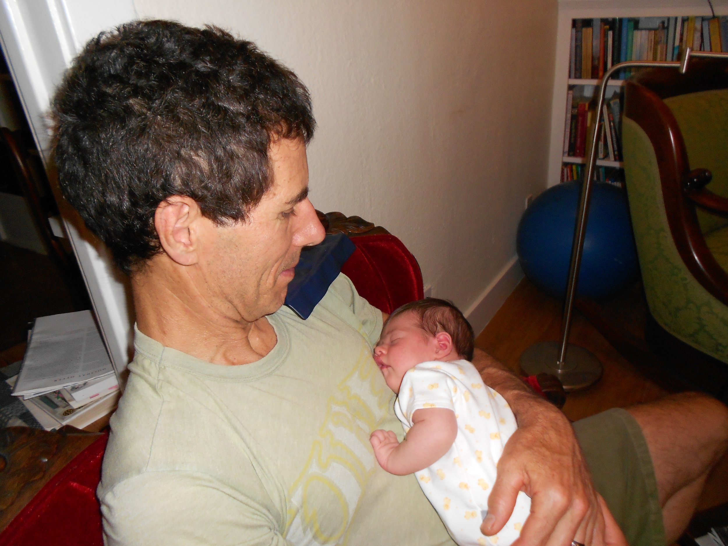 Susan-story-lucy-2-weeks-old-with-daddy.jpg