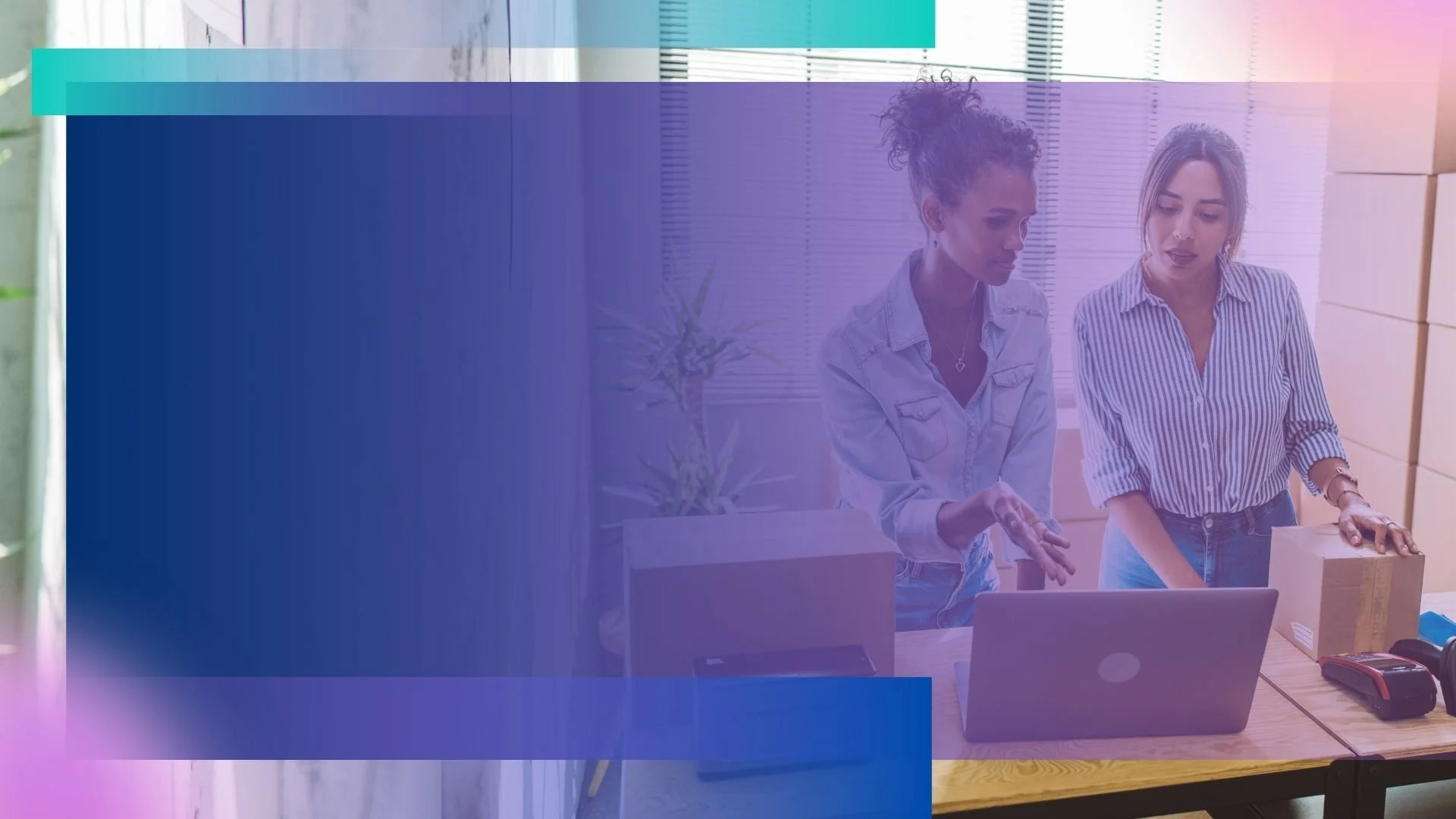 Two small business owners discussing things on a computer