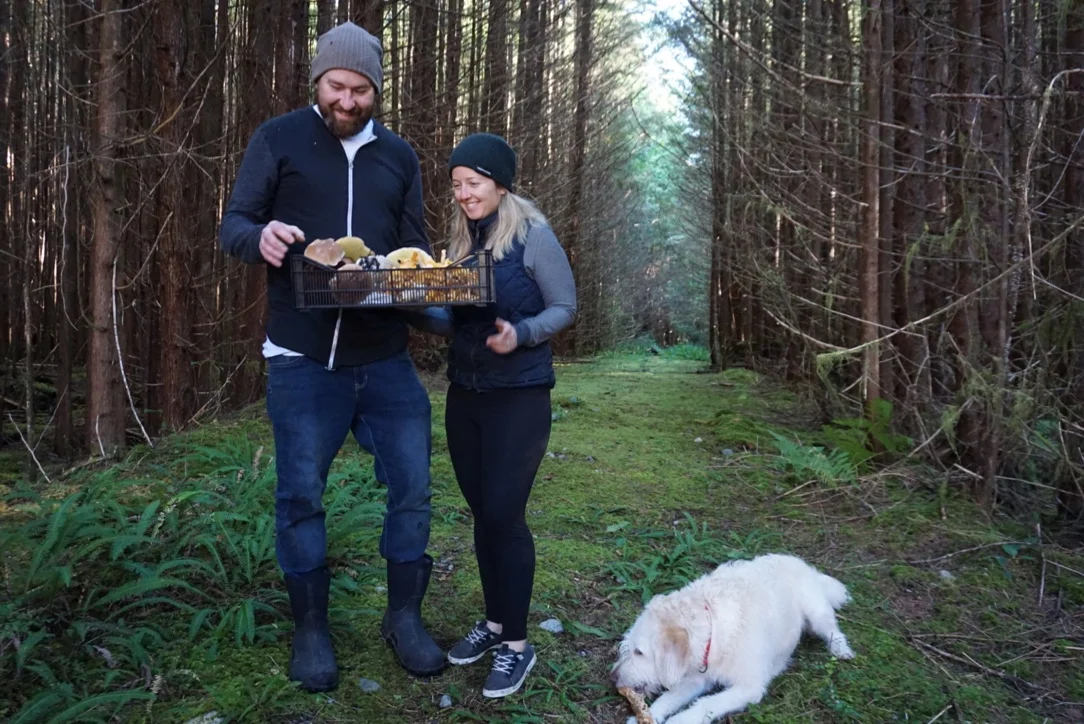 Foraging with Wolf in the Fog chef Nick Nutting and bar manager Hailey Pasemko, and their dog, Oscar.
