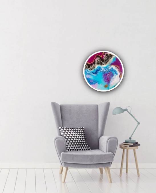 small round resin art with deep blues and shimmering gold