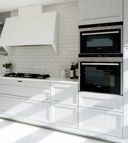 Built-in-appliances-and-white-subway-tiles.jpg