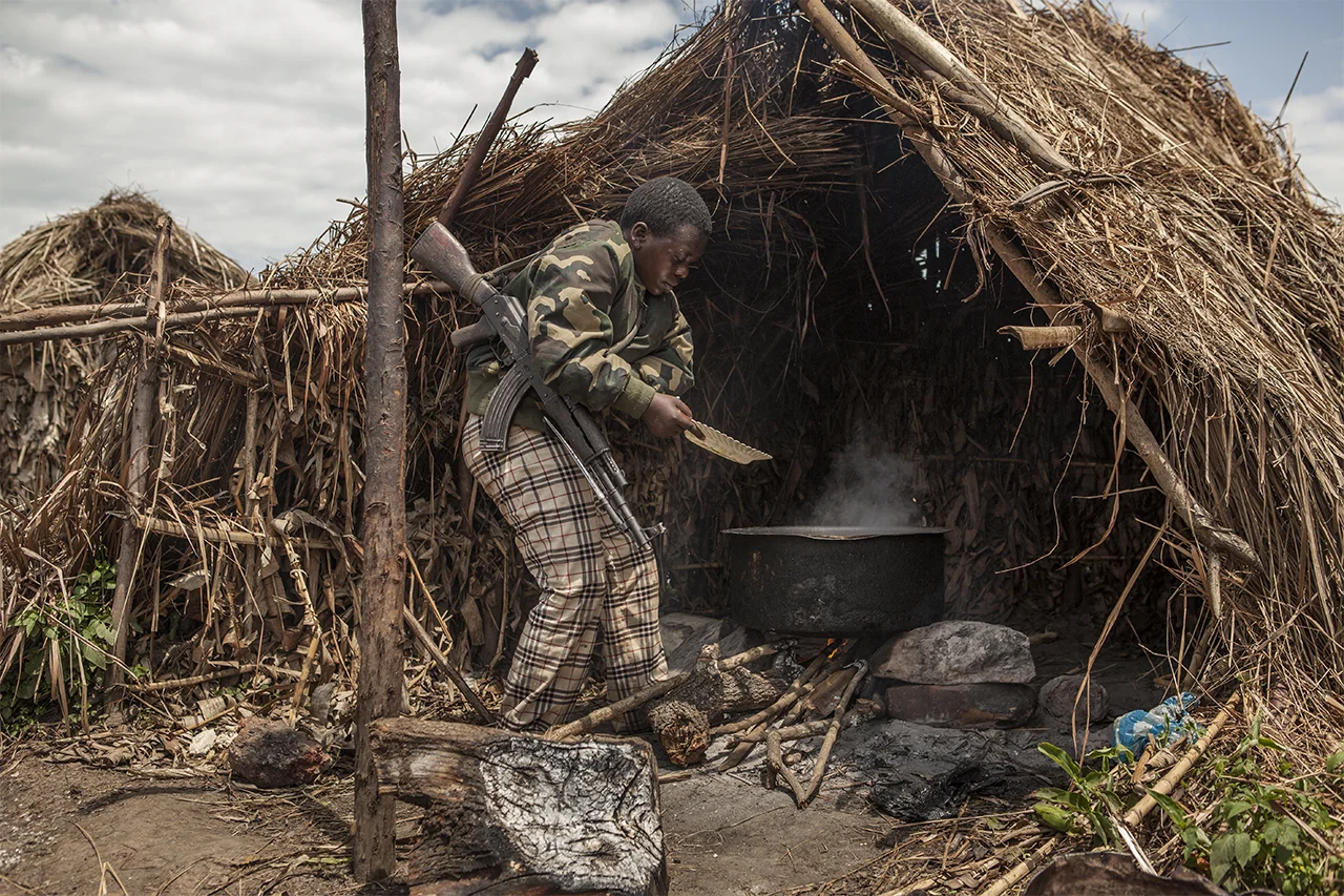 Major Francine Kanier prepare food. The food comes from the taxes that Mai Mai Shetani/FDP imposes to the local population. Buramba military base, Nyamilima, North Kivu, DRC