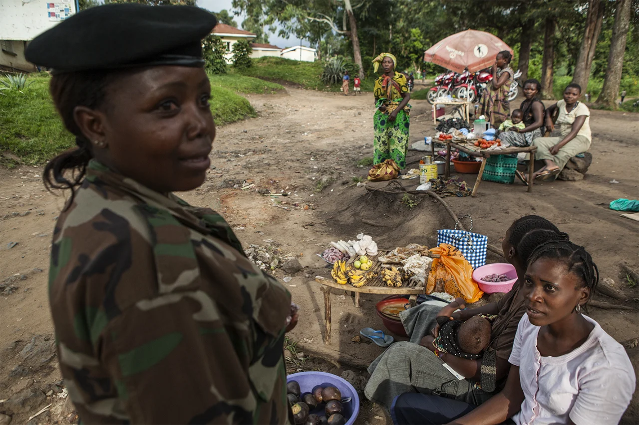 Major Mathilde Samba walks through the village of Rutshuru, controlled by M23 rebel militia. North Kivu, DRC
