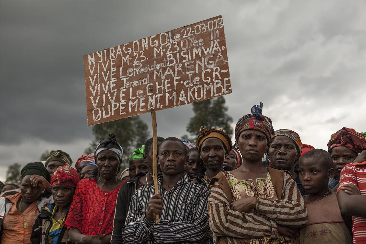 M23 rebel group meet the local population after fighting due to the split between former joint-leaders Bosco Ntaganda and Sultani Makenga. Here, in Kibumba village (territory controlled by M23) the population is called to receive the rebels. Kibumba, North Kivu, DRC