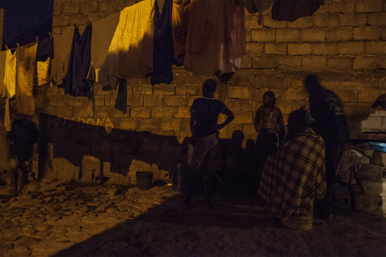 Ja and her neighbors share most of the moments of the day, at work in Charco and at home. Here a moment after a shared donner. Ribeira da Barca, Santiago, Cape Verde