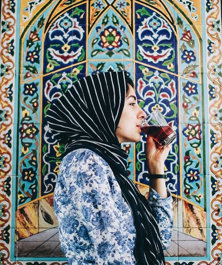 Hoda Katebi posing for a photoshoot with @brownbook by @kevnserna .