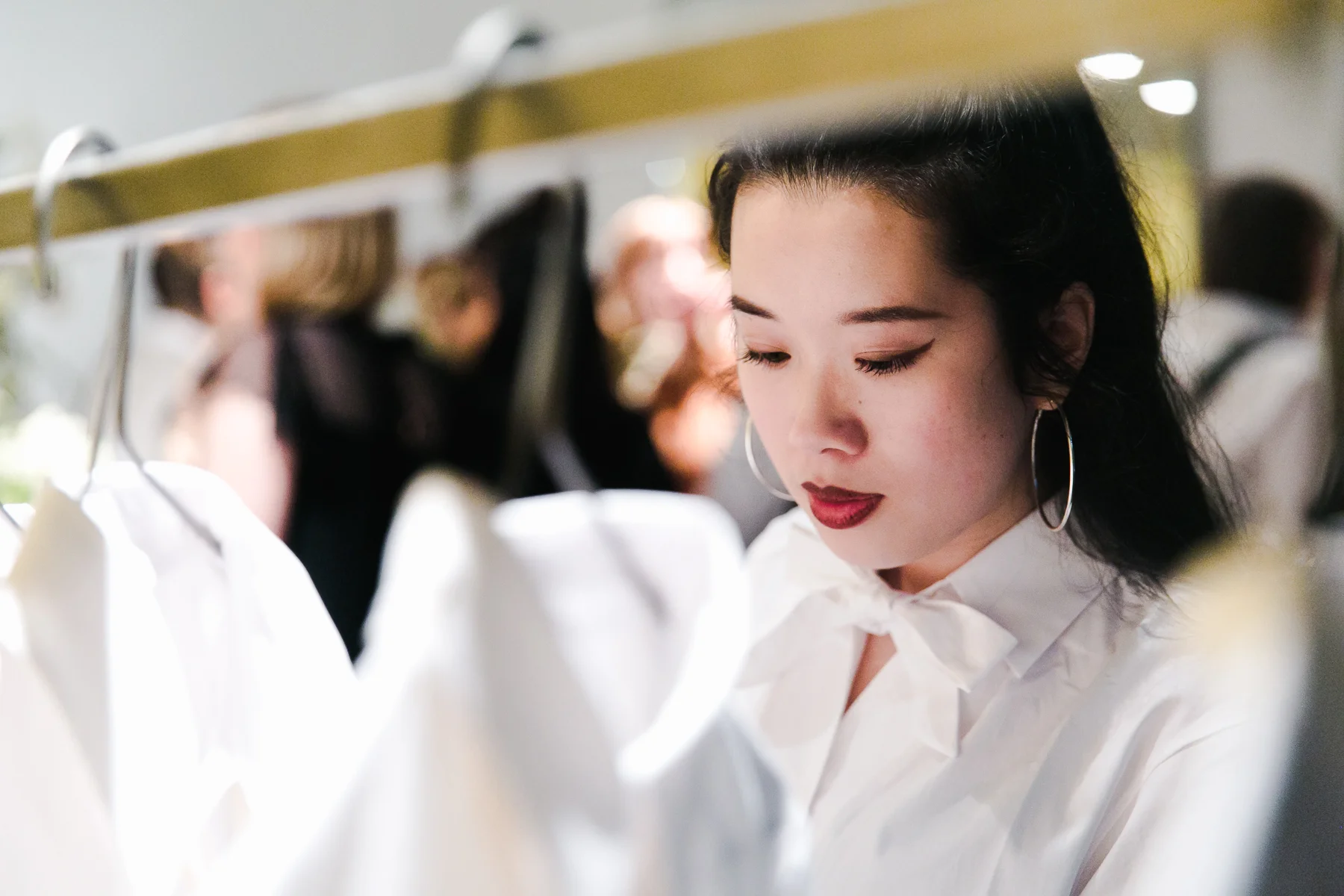 SUSTAIN Fashion Editor, Julia Le, wearing The Preposition Shirt while viewing the collection.