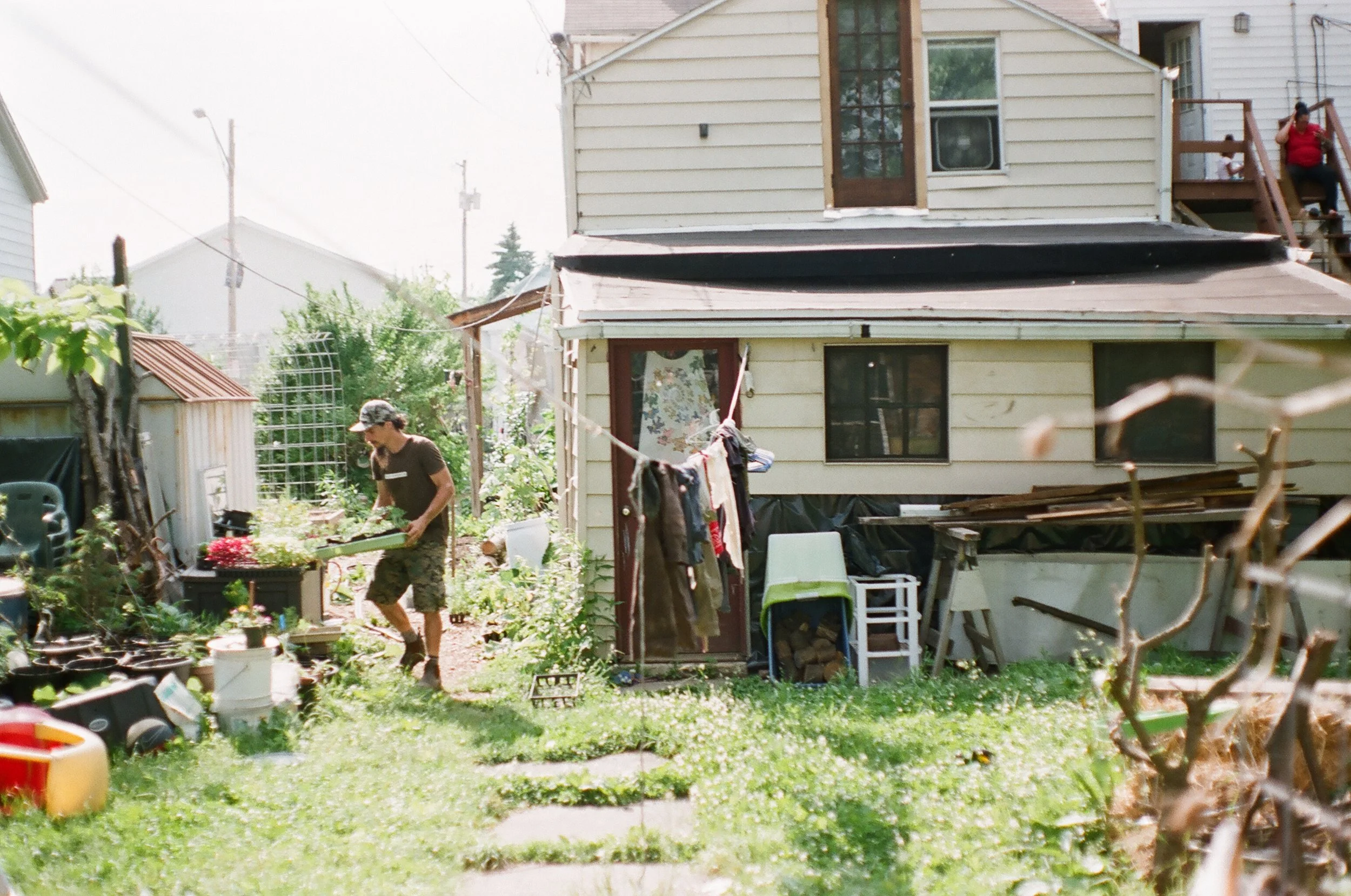 Christian working the garden in his yard