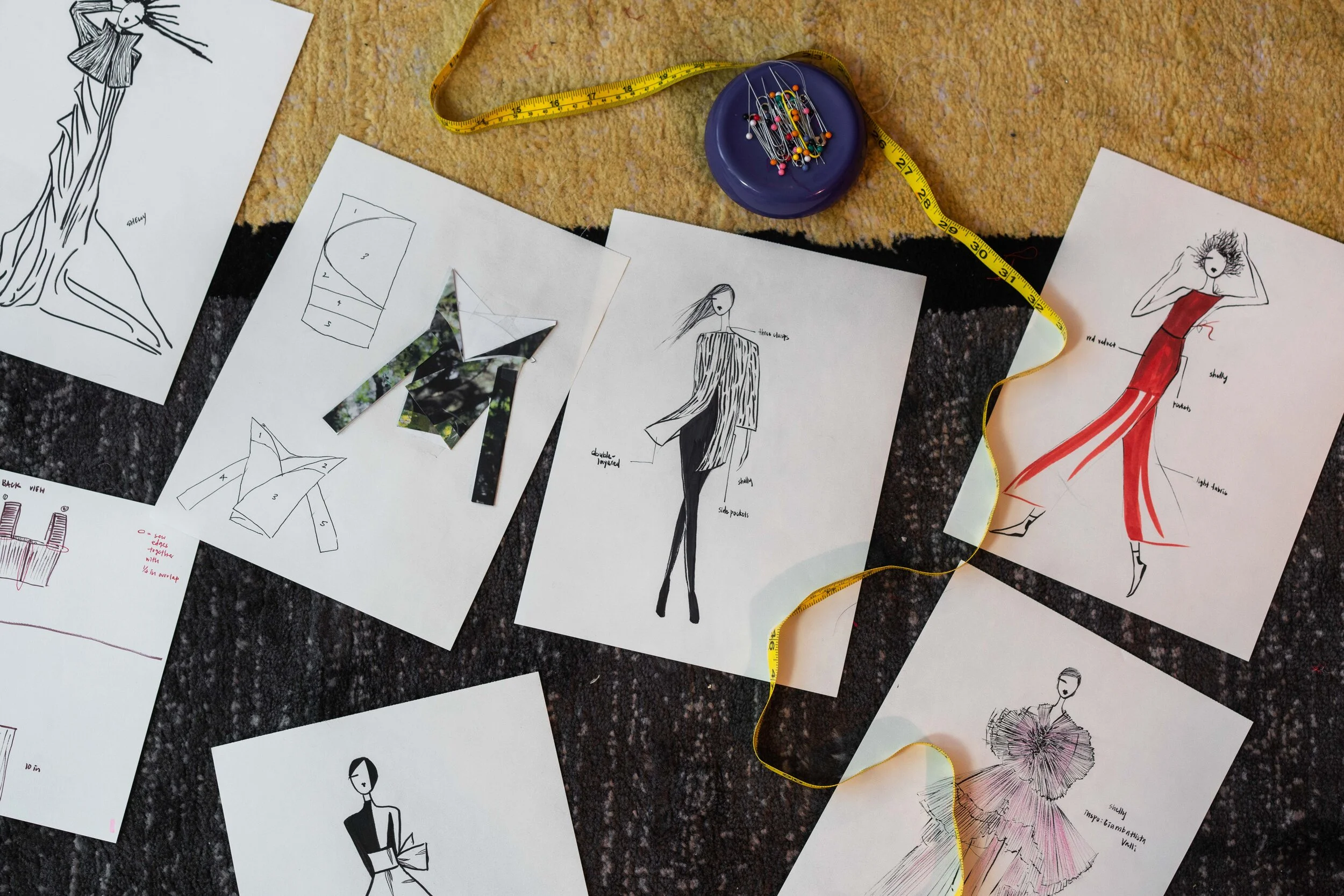 A series of Xu’s sketches, including original designs and inspiration, as well as some of the patterns and paper-folding technique she uses in planning her designs.