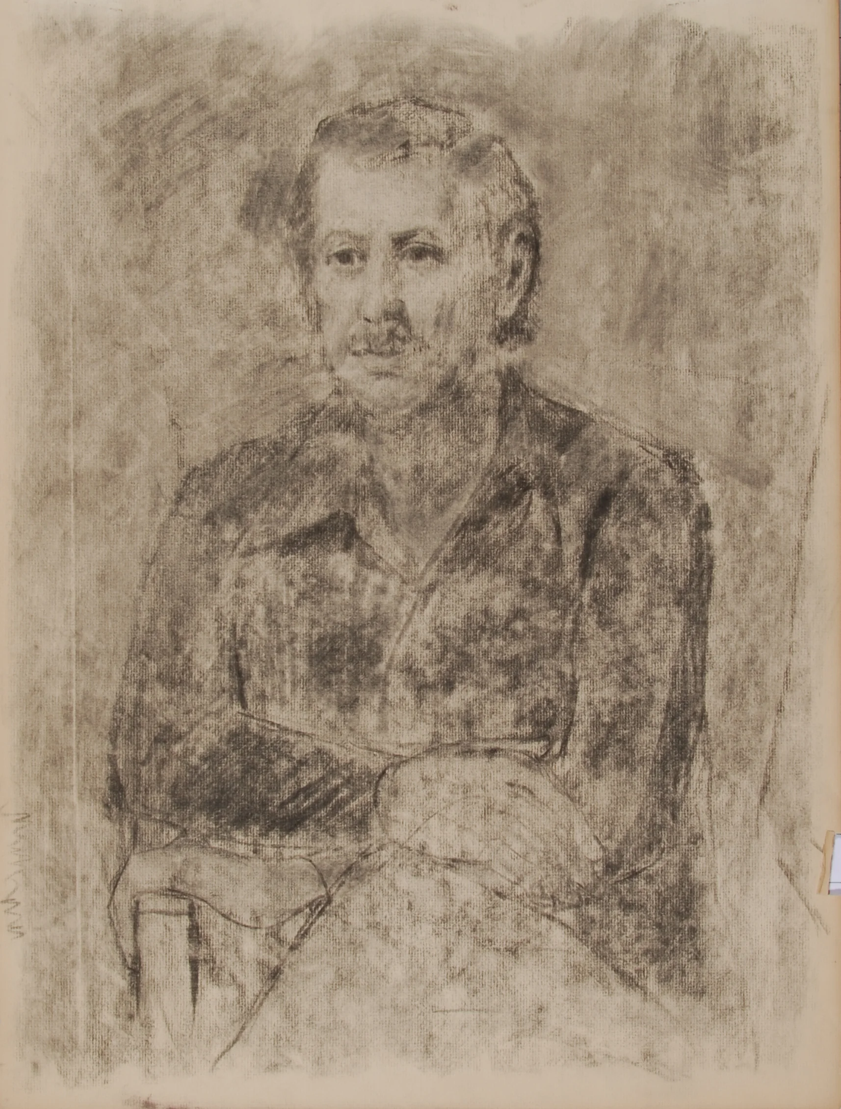 Image #0112: Seated Caucasian man wearing black wide-collared shirt, arms folded