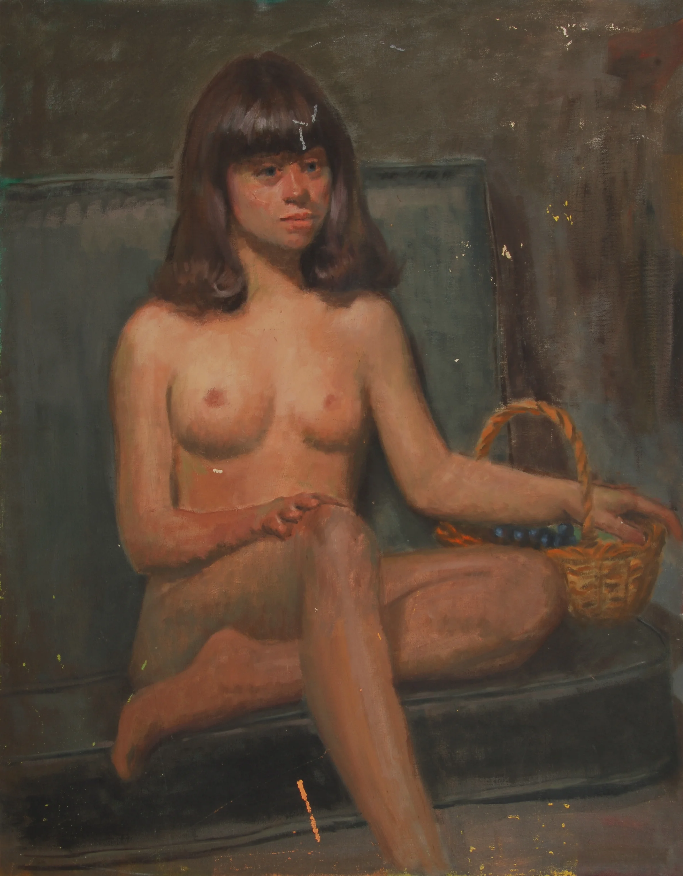 Image #0158: Nude Caucasian woman with brown hair and bangs, sitting on a couch and holding a basket