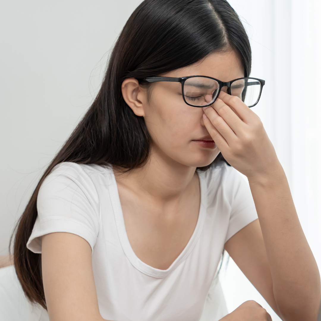 woman struggling with eye pain