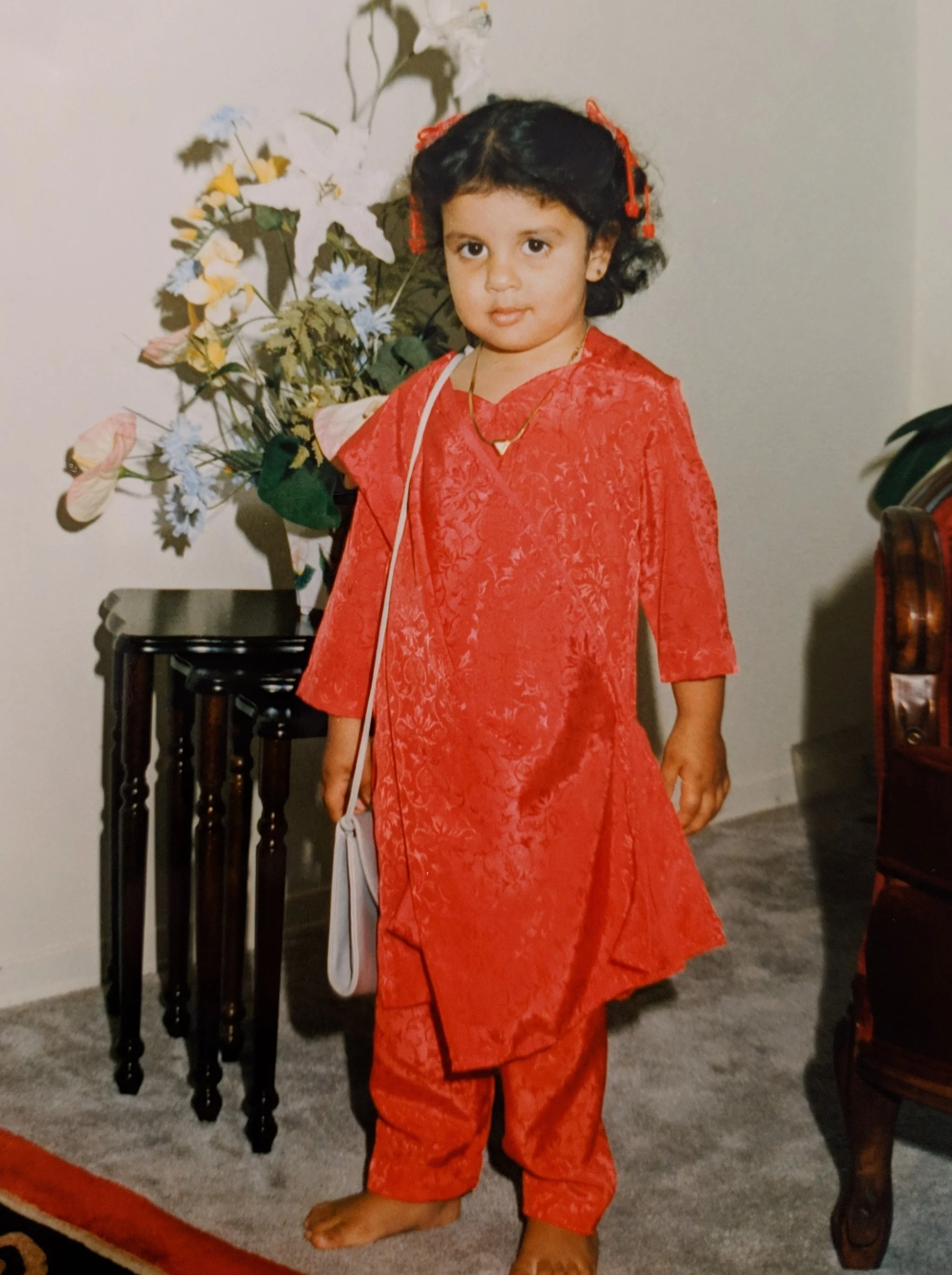 Me at 3 or 4 years old, very pleased with my very grownup purse.