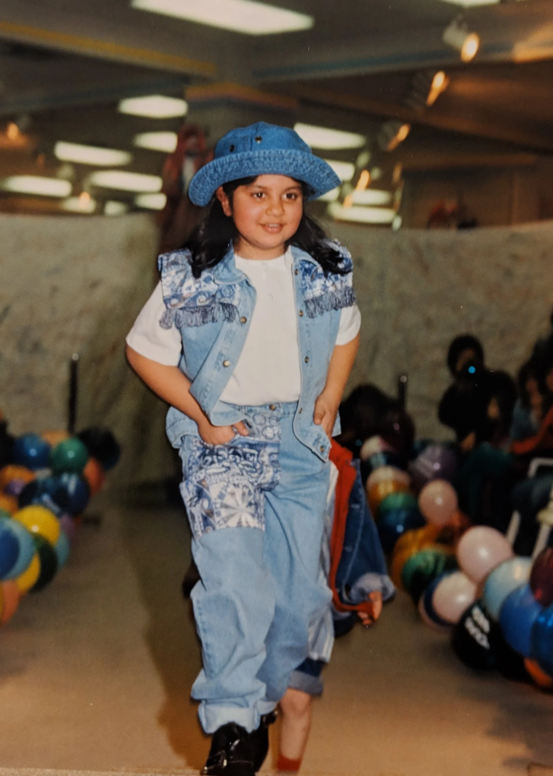 Me at about 8 years old, walking in a mall fashion show. I wanted to take home this entire outfit. I really loved denim.