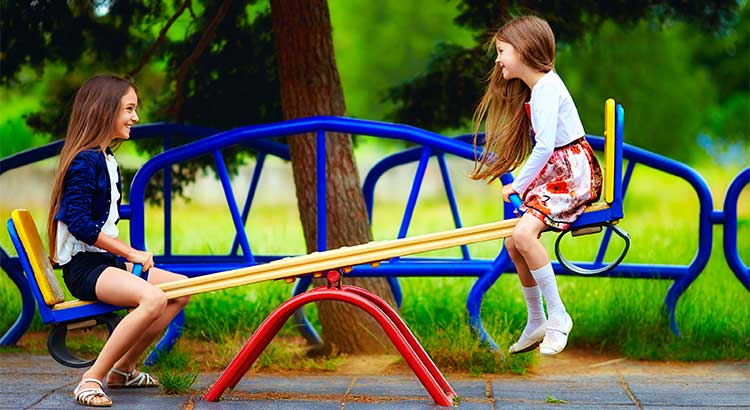Kids playing seesaw